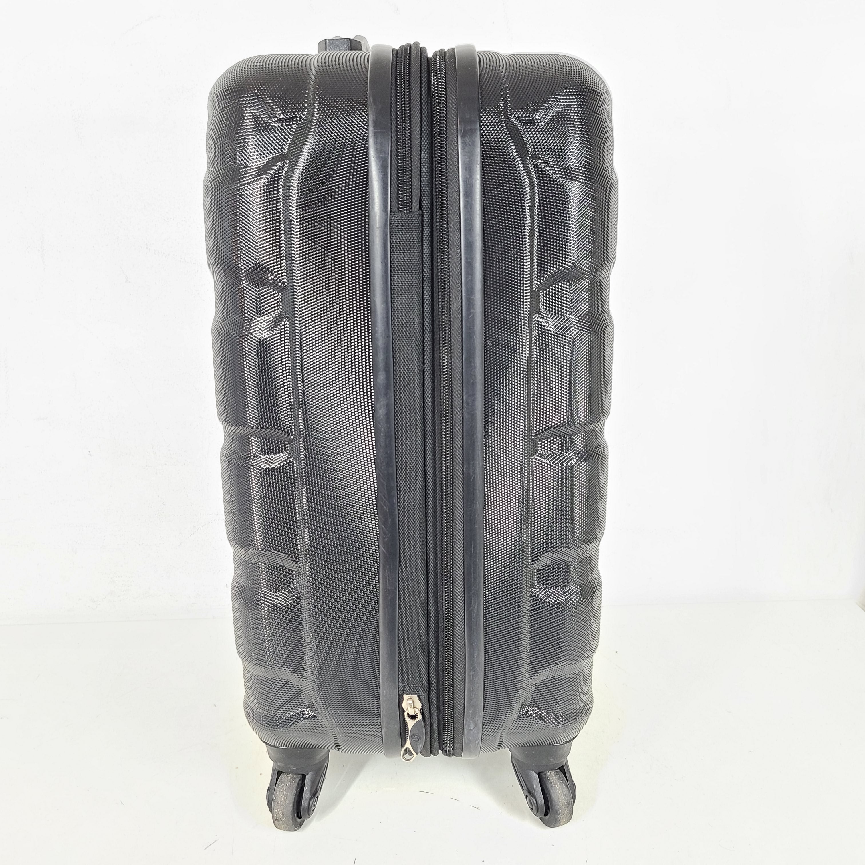 A black Samsonite spinner luggage.