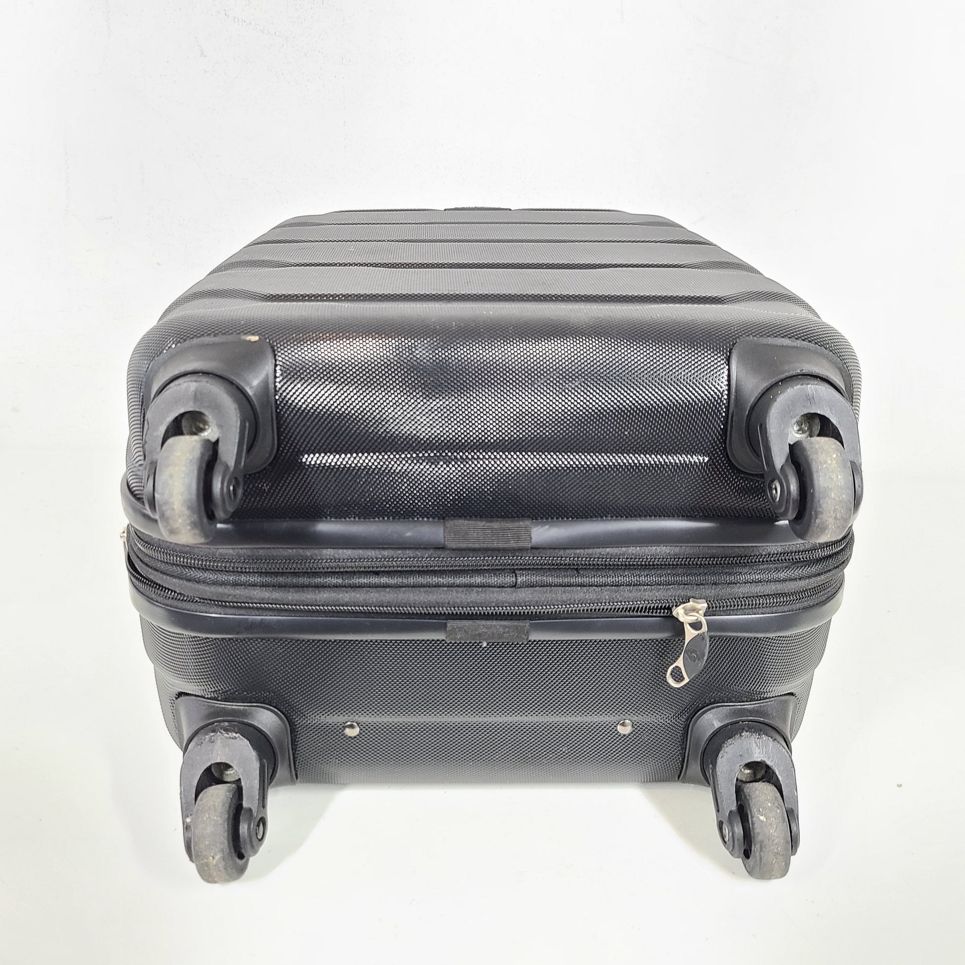 A black Samsonite spinner luggage.