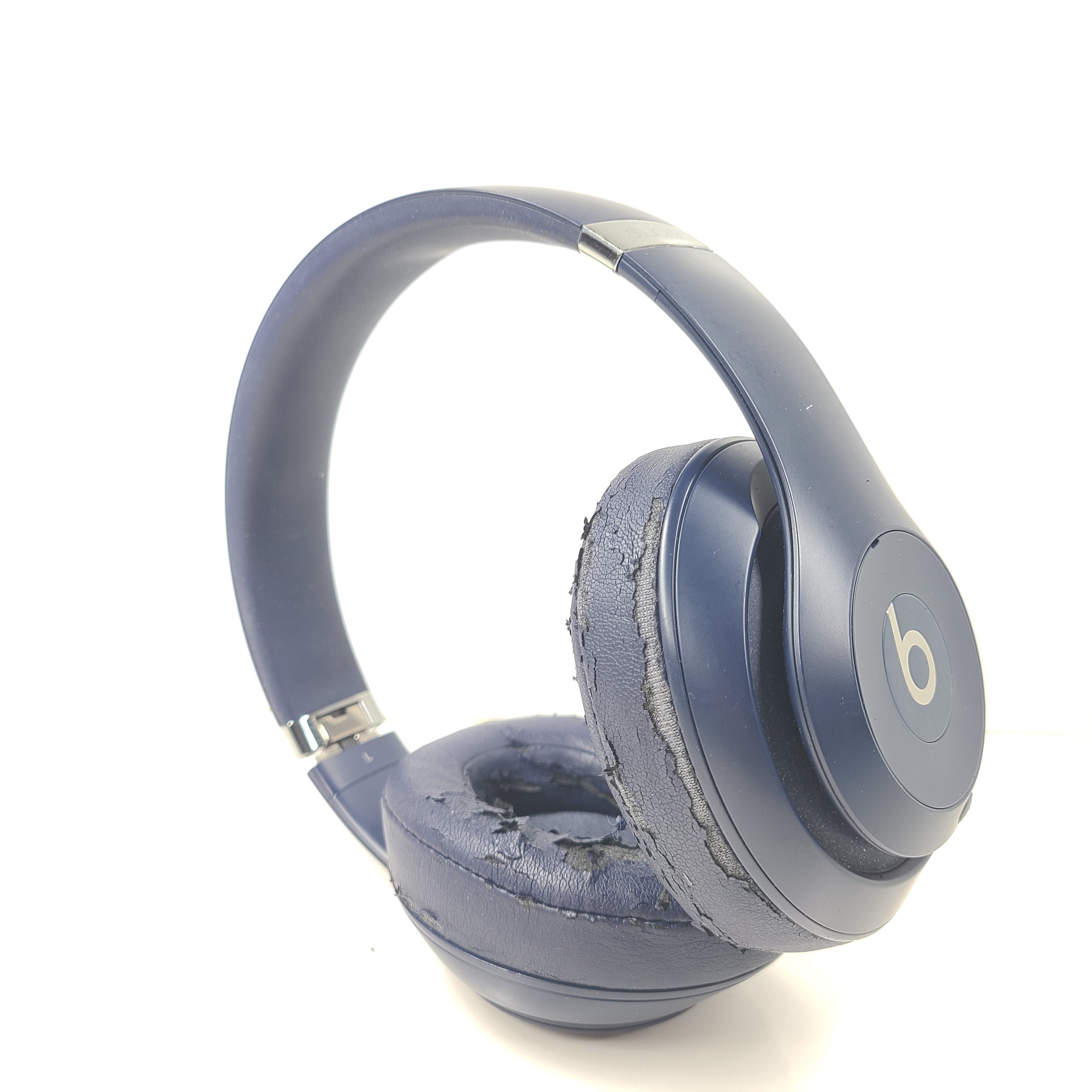 A pair of blue Beats wireless headphones.