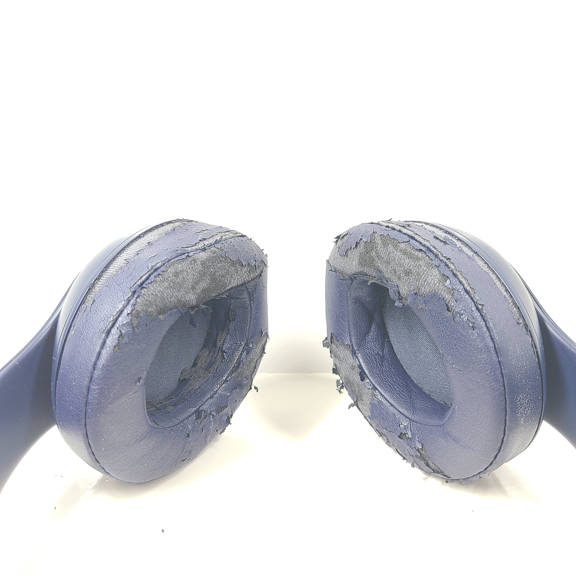 A pair of blue Beats wireless headphones.
