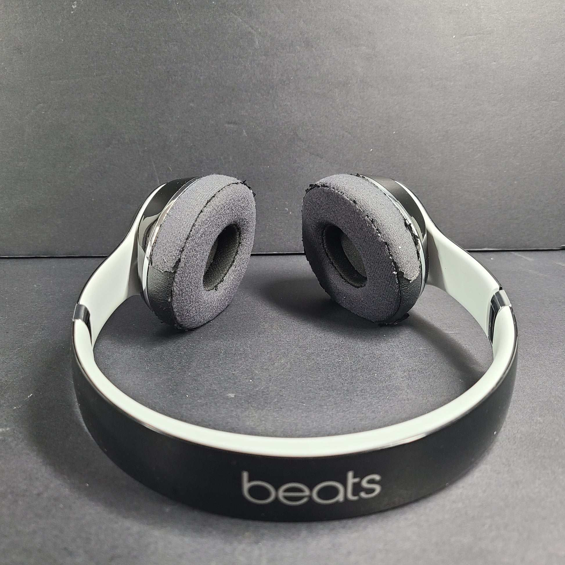A pair of Beats Solo Wired Headphones with a red cable