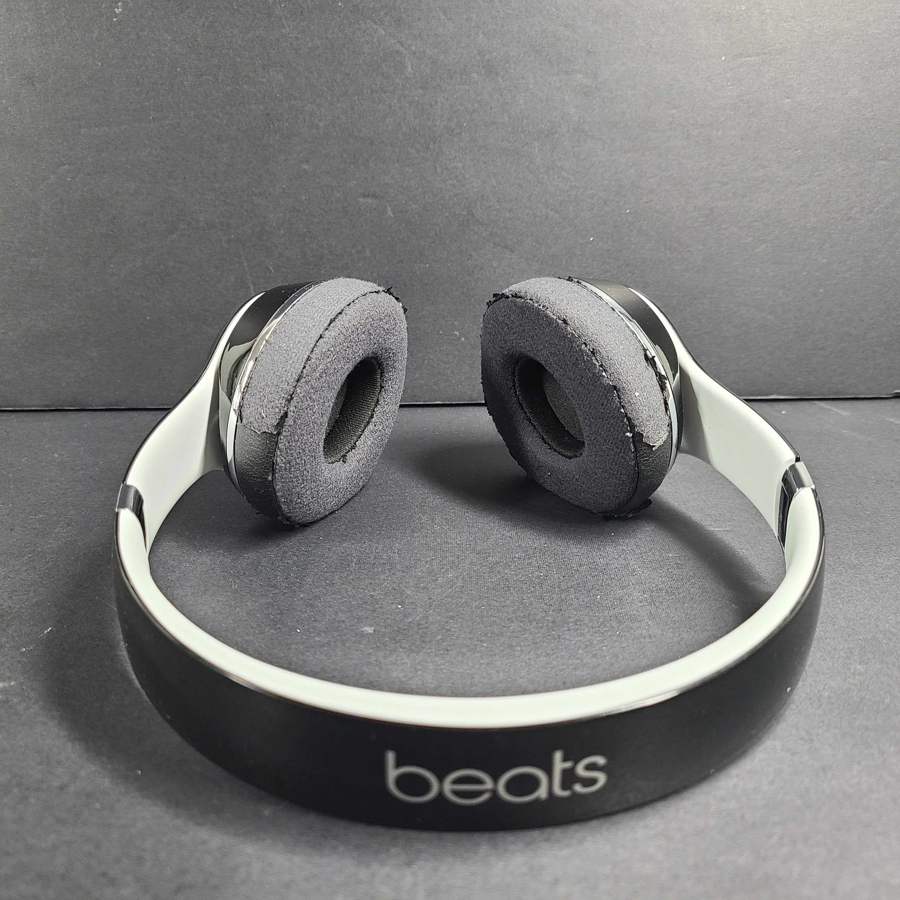 A pair of Beats Solo Wired Headphones with a red cable