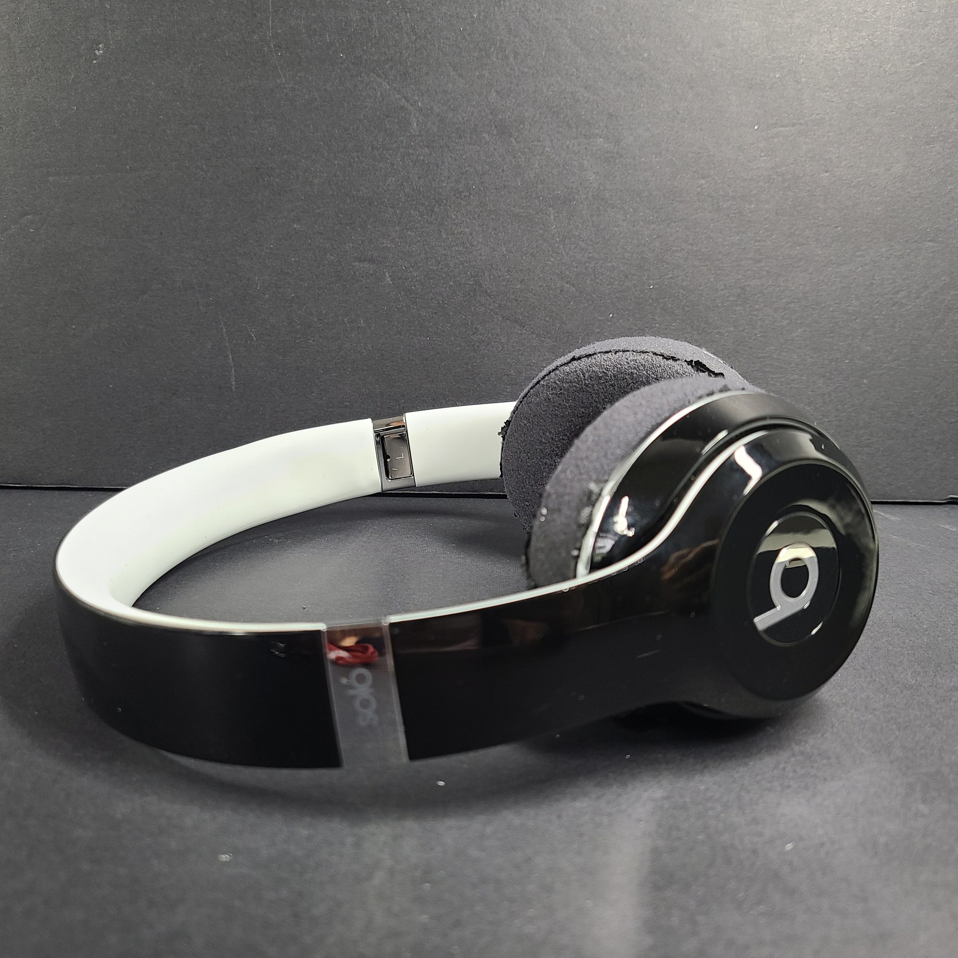 A pair of Beats Solo Wired Headphones with a red cable