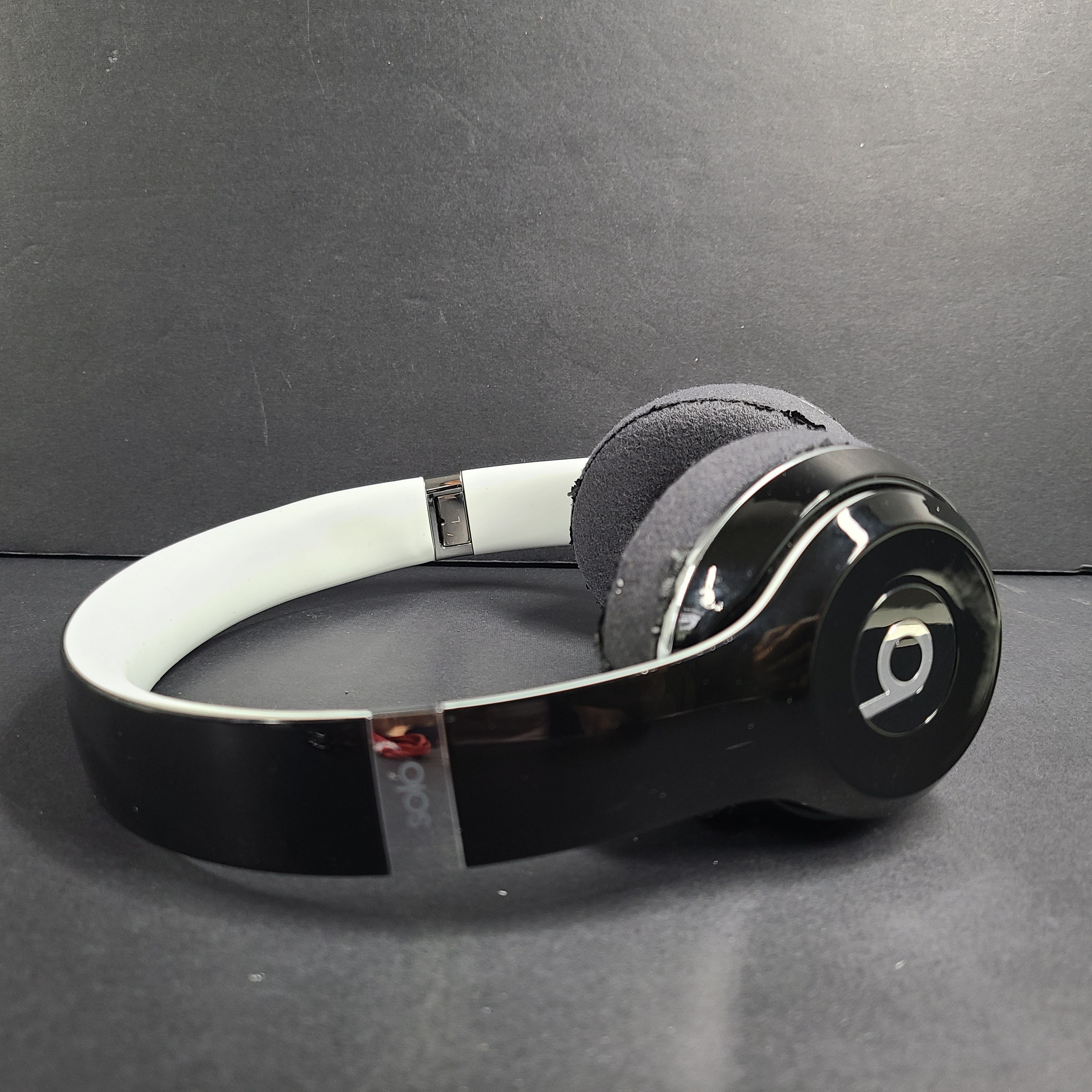 A pair of Beats Solo Wired Headphones with a red cable