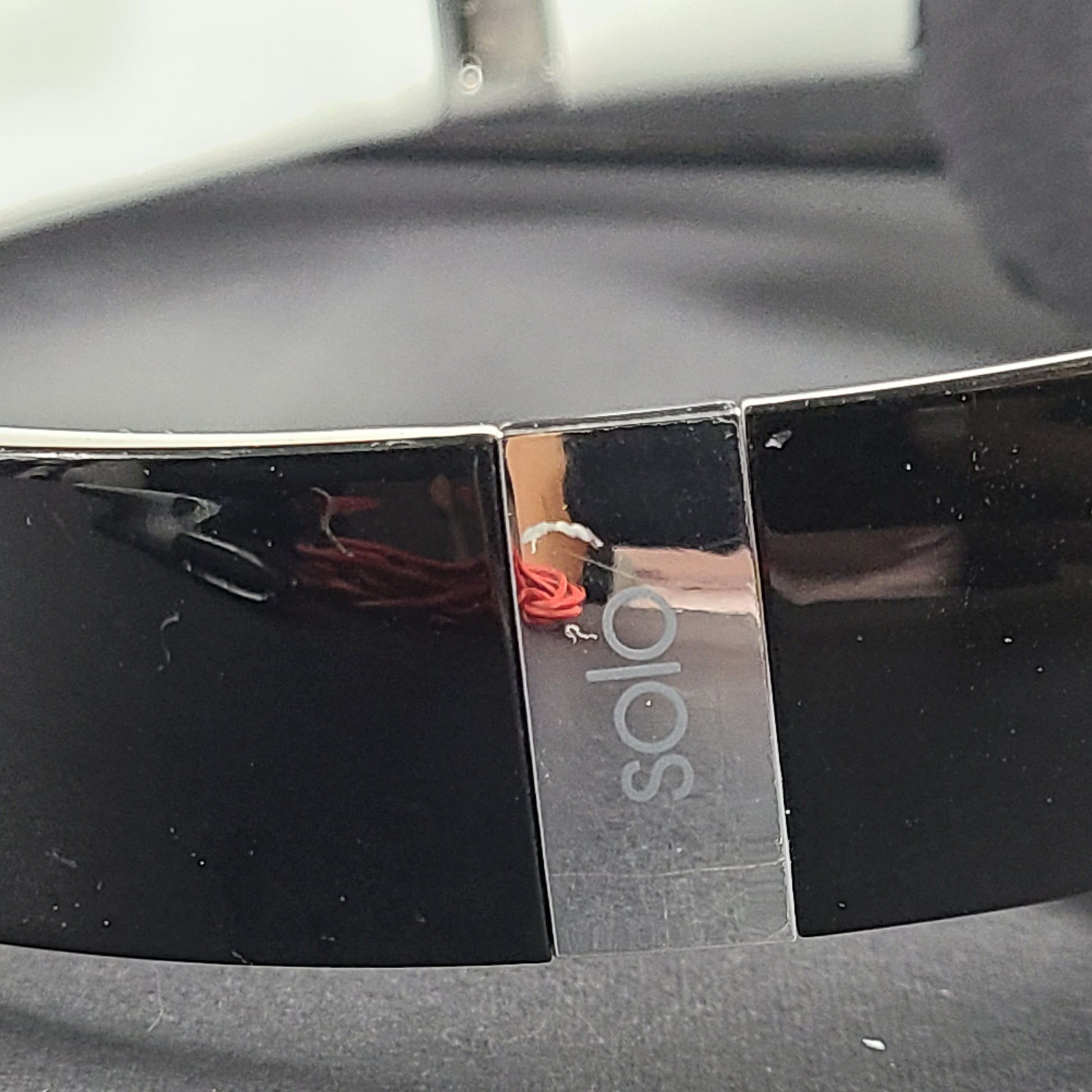 A pair of Beats Solo Wired Headphones with a red cable