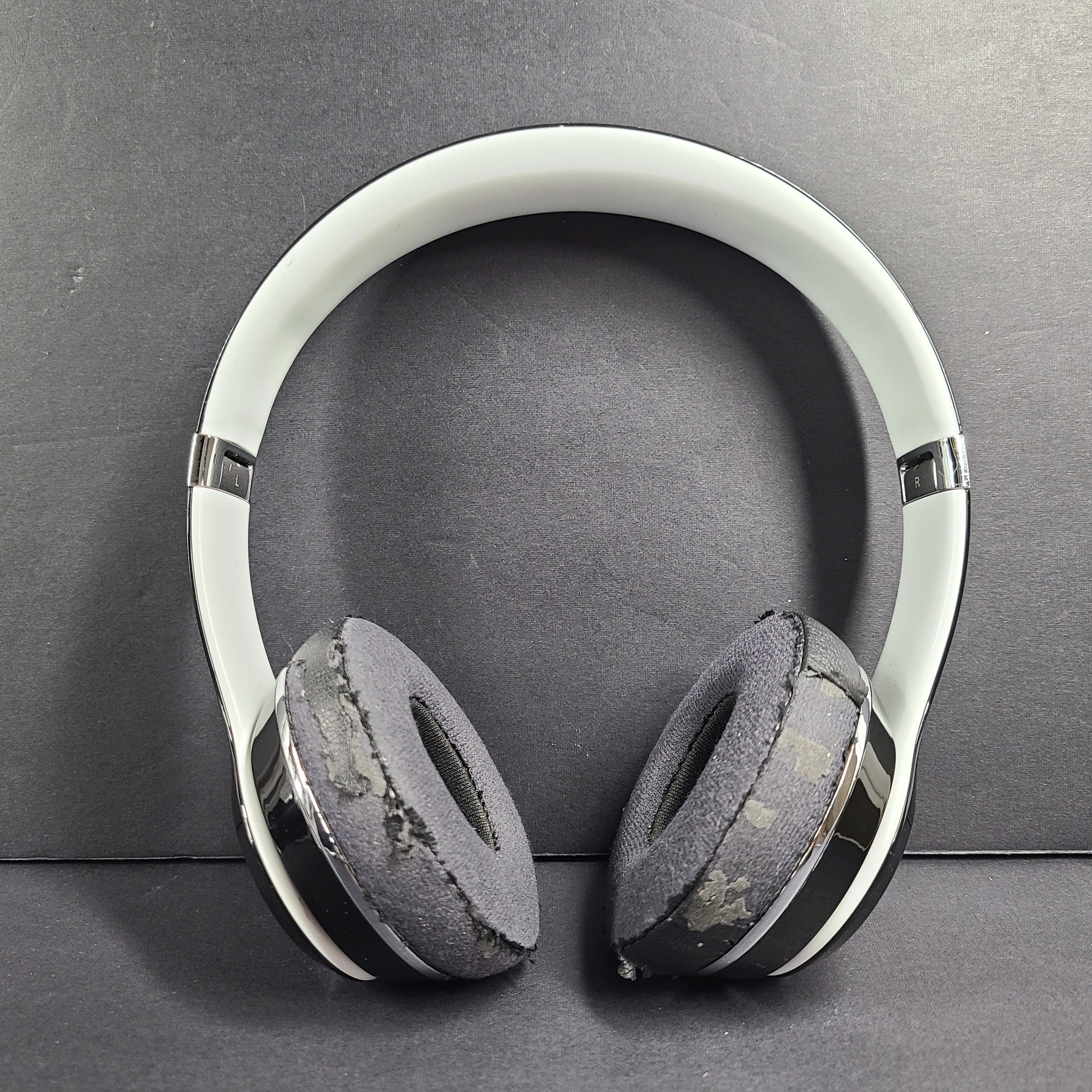 A pair of Beats Solo Wired Headphones with a red cable