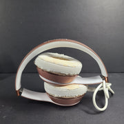A stylish rose gold on-ear headphones by Beats Solo3 Wireless.