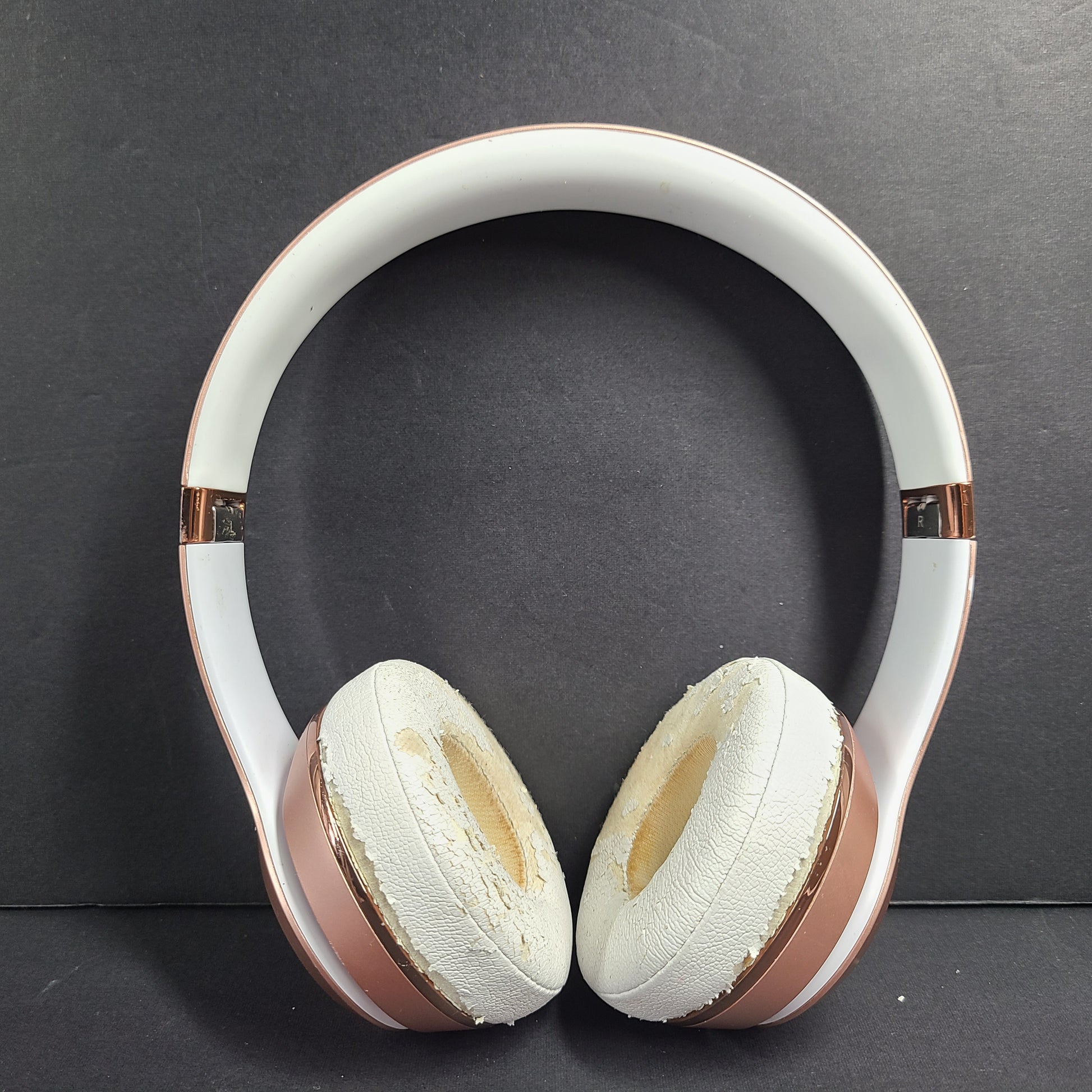 A stylish rose gold on-ear headphones by Beats Solo3 Wireless.