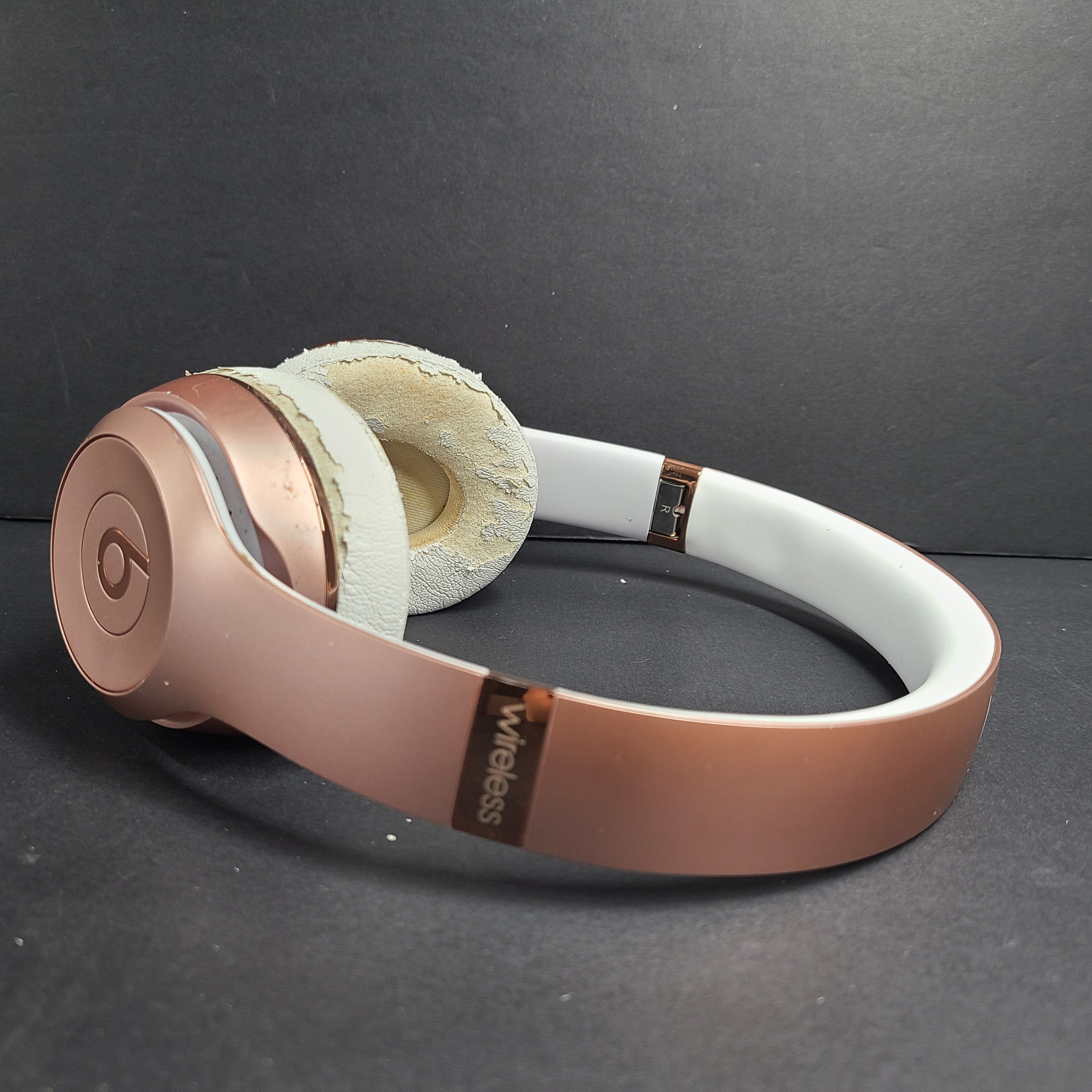 A stylish rose gold on-ear headphones by Beats Solo3 Wireless.