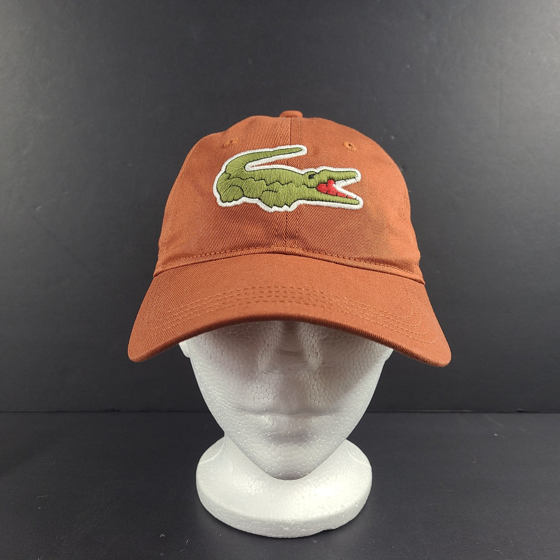 A stylish Lacoste baseball cap in brown color.