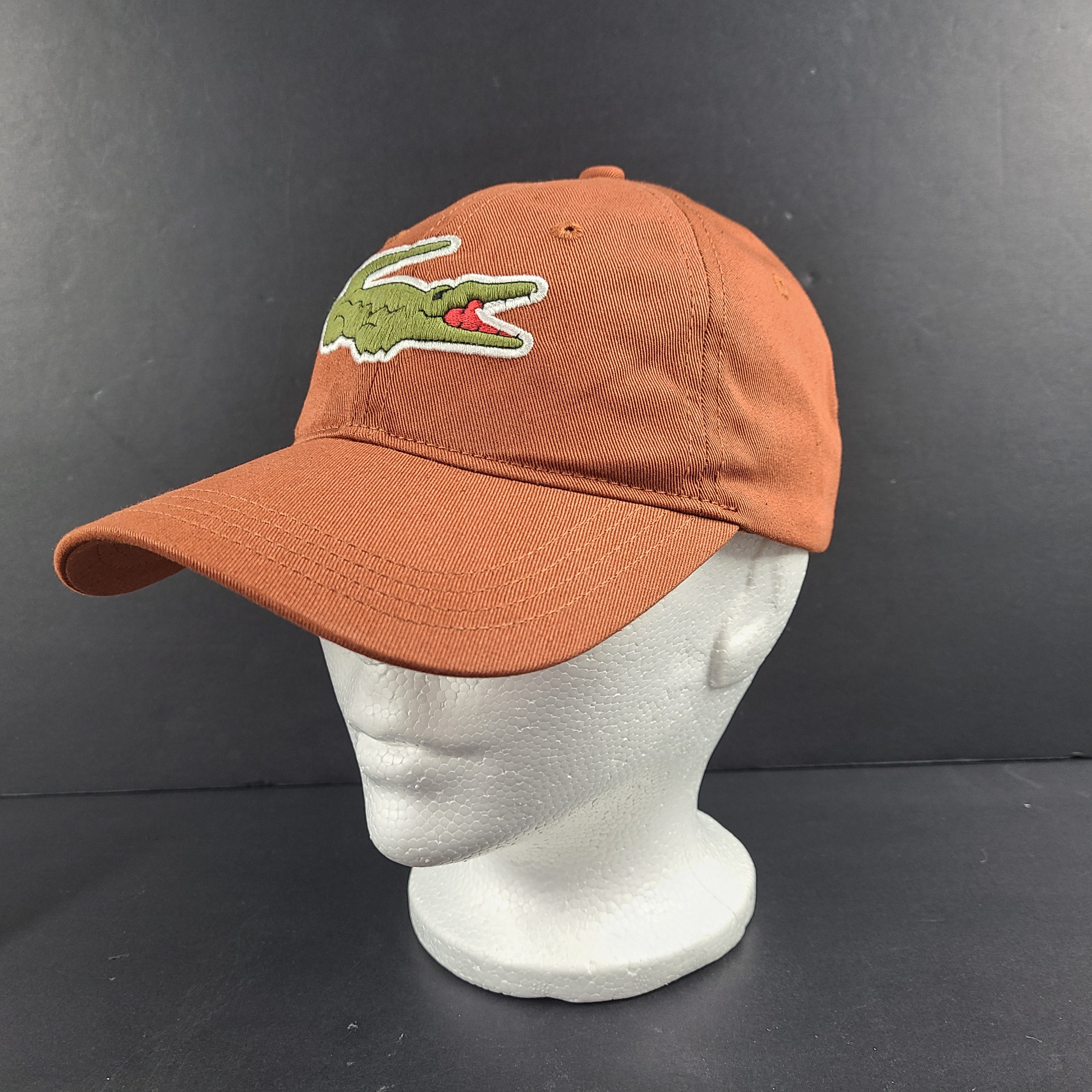 A stylish Lacoste baseball cap in brown color.