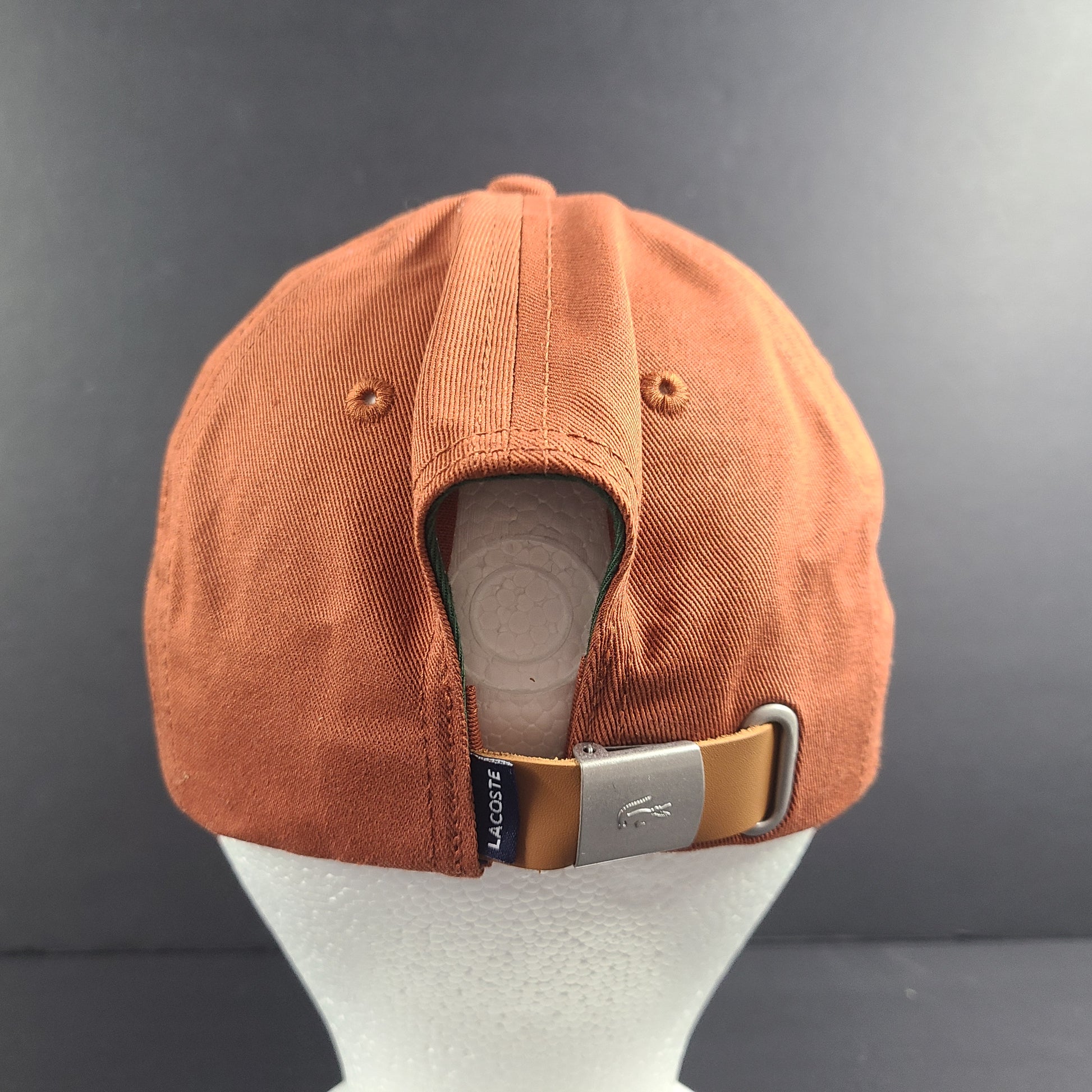 A stylish Lacoste baseball cap in brown color.