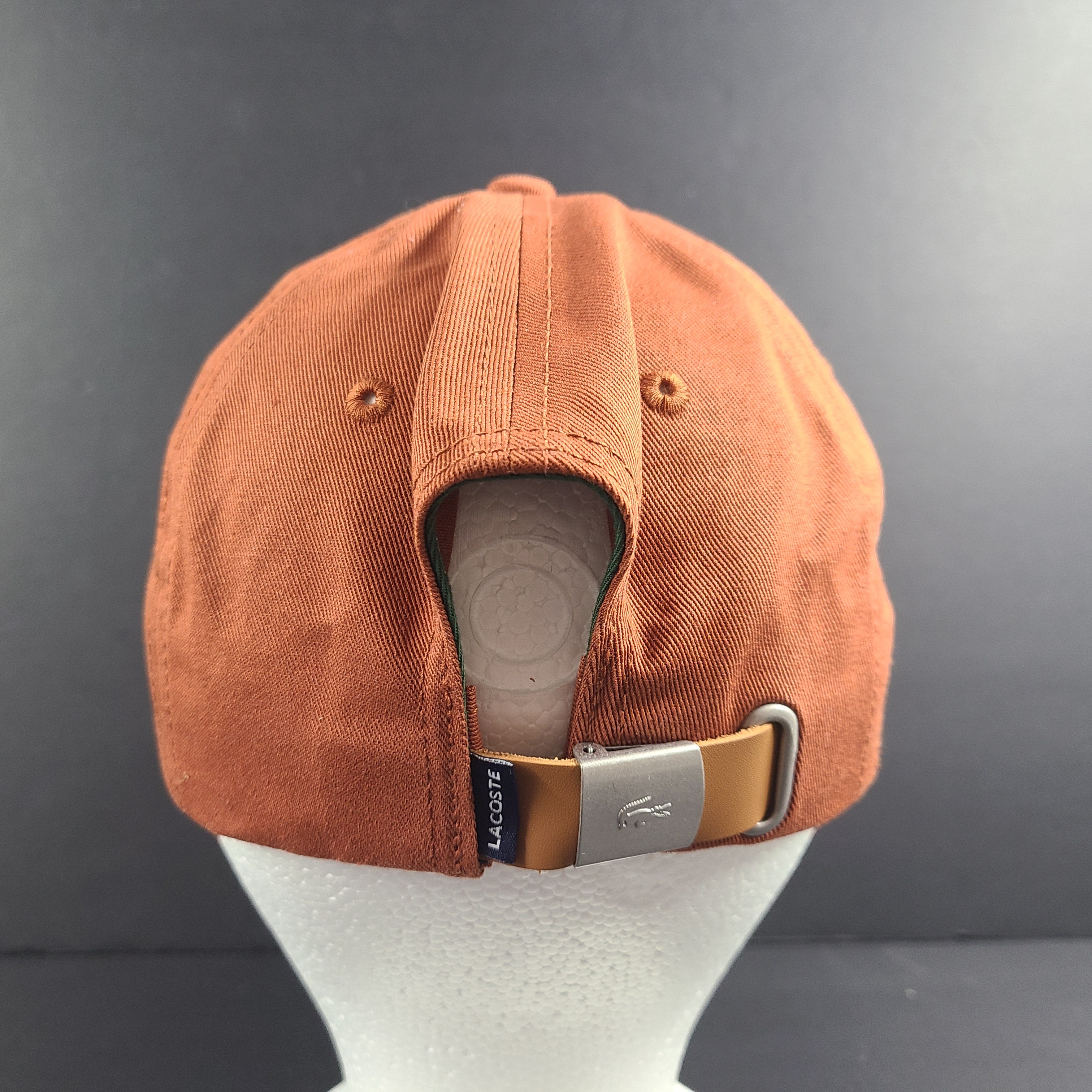 A stylish Lacoste baseball cap in brown color.