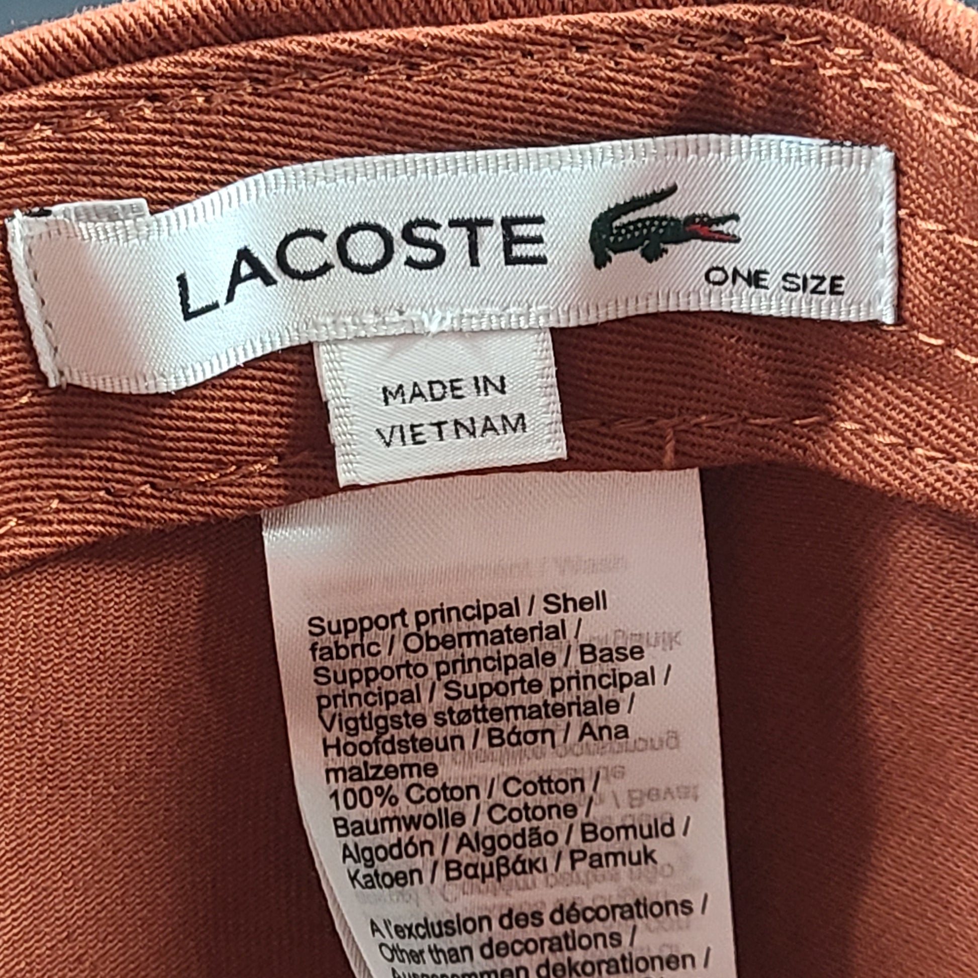 A stylish Lacoste baseball cap in brown color.