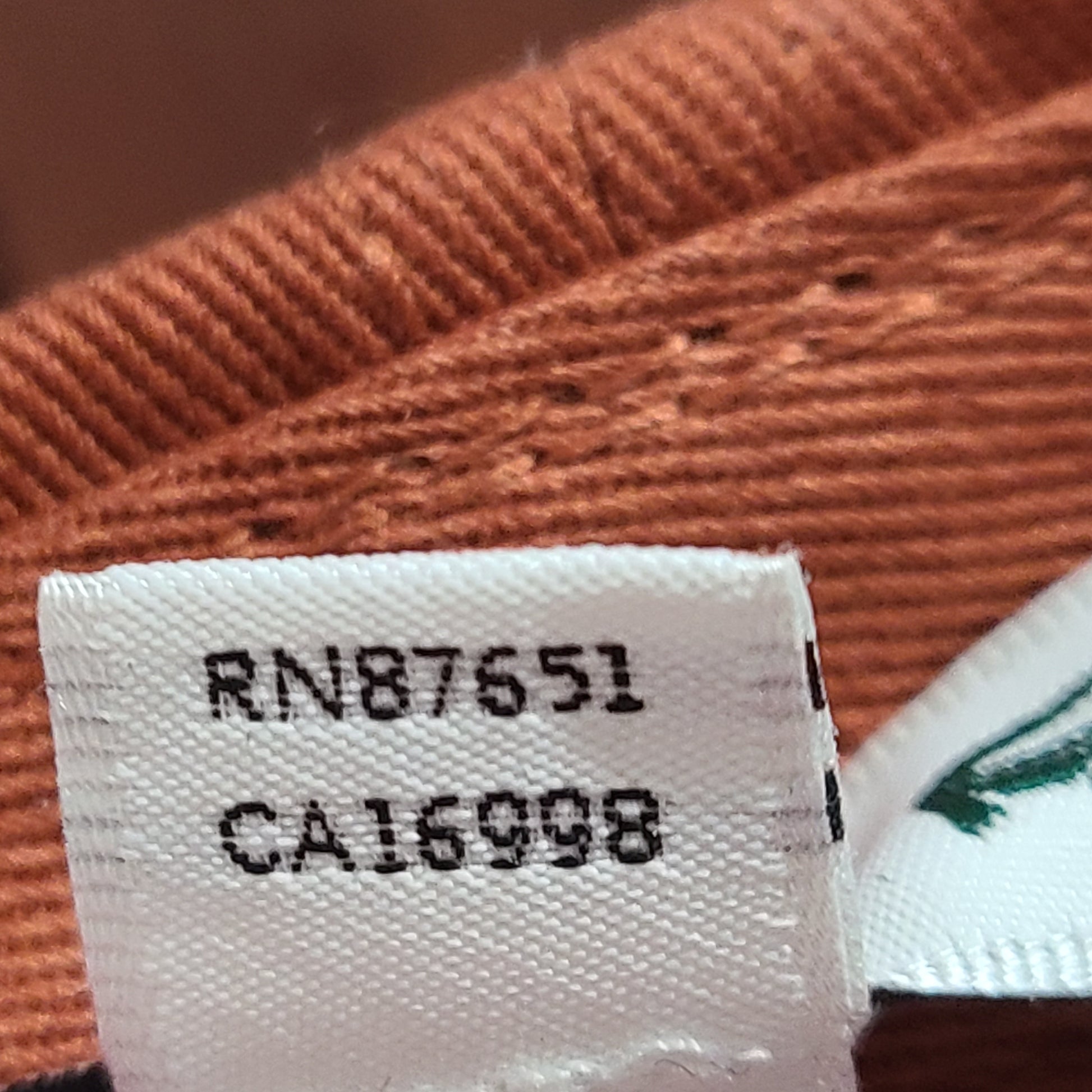 A stylish Lacoste baseball cap in brown color.