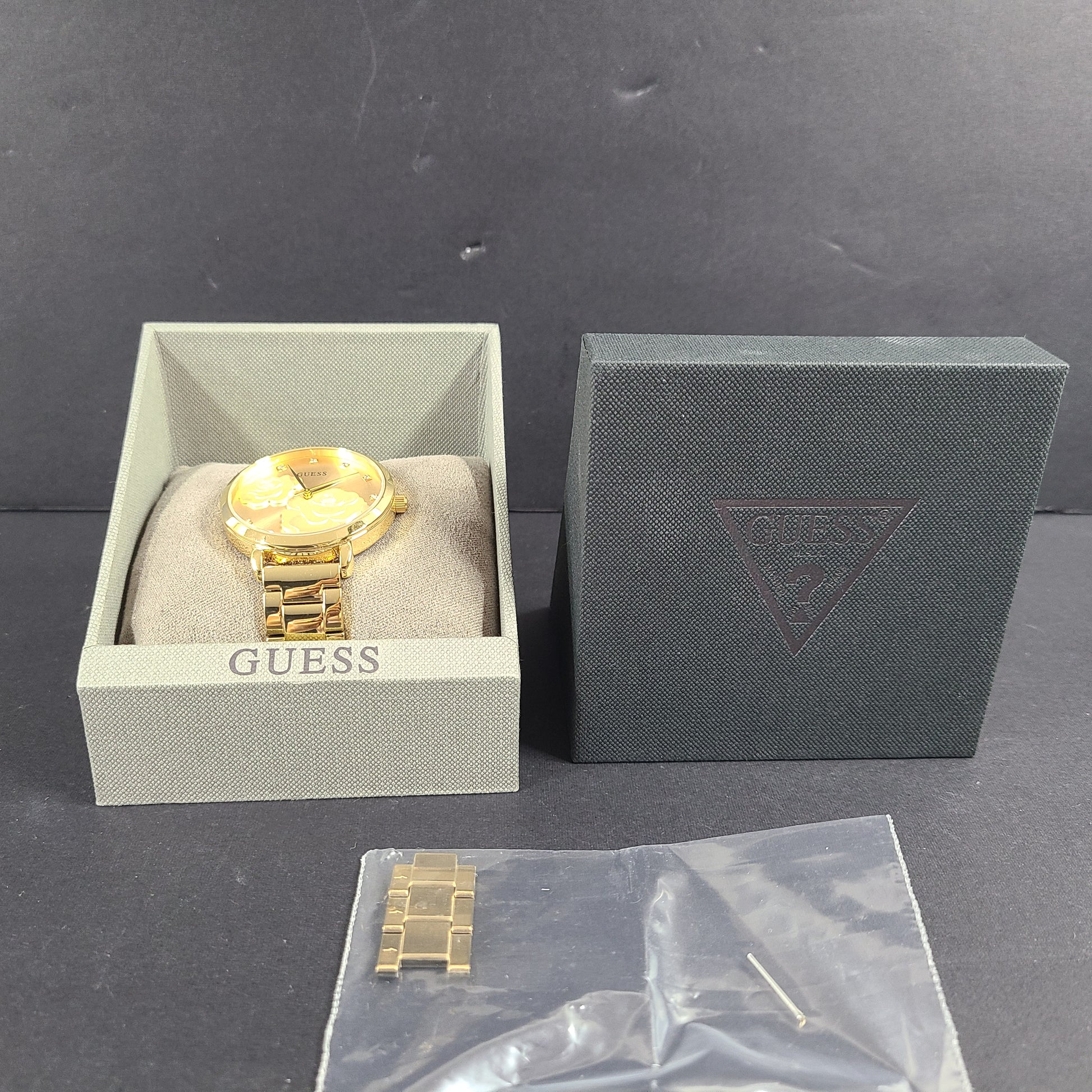 A stylish Guess rose gold-tone stainless steel women's watch.