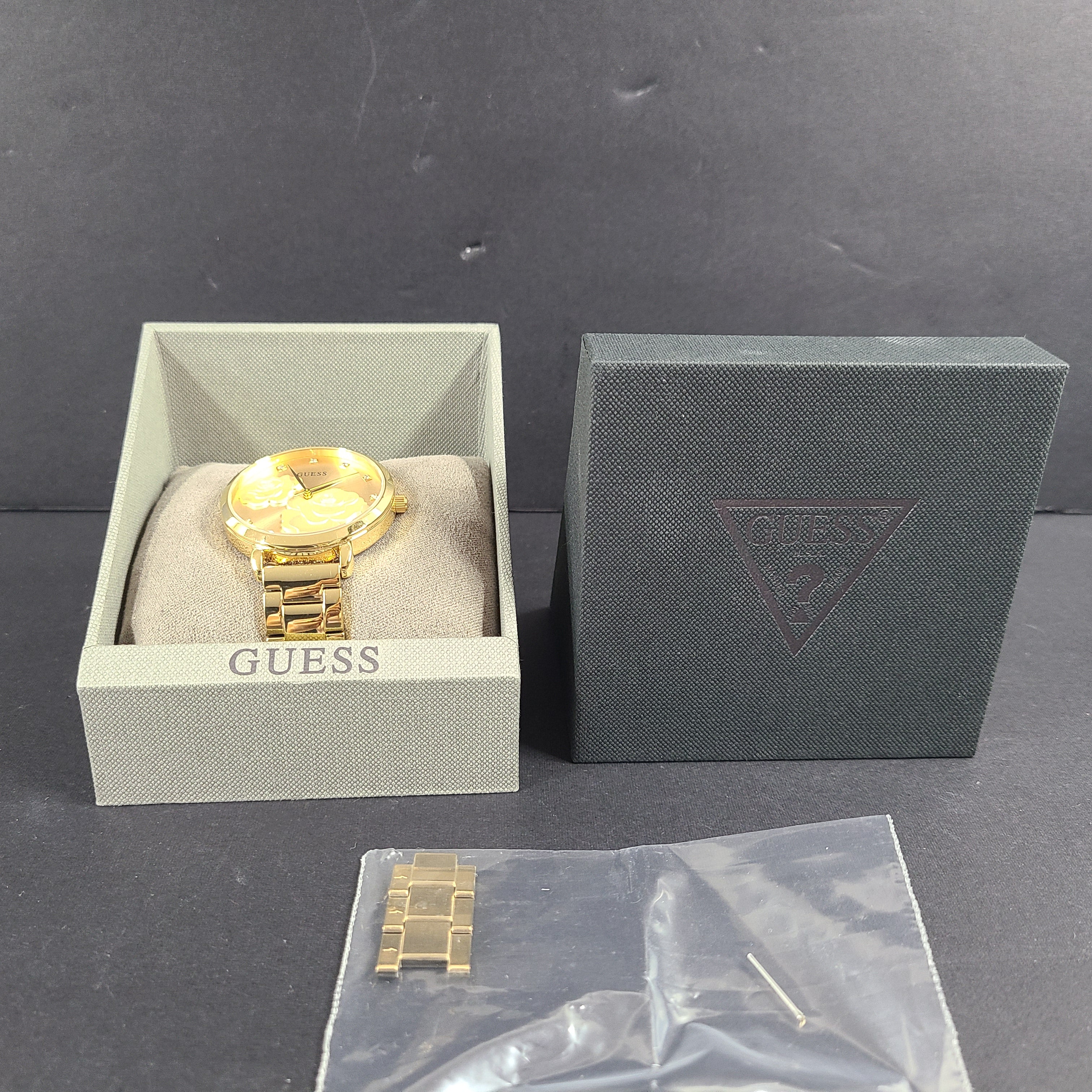 A stylish Guess rose gold-tone stainless steel women's watch.