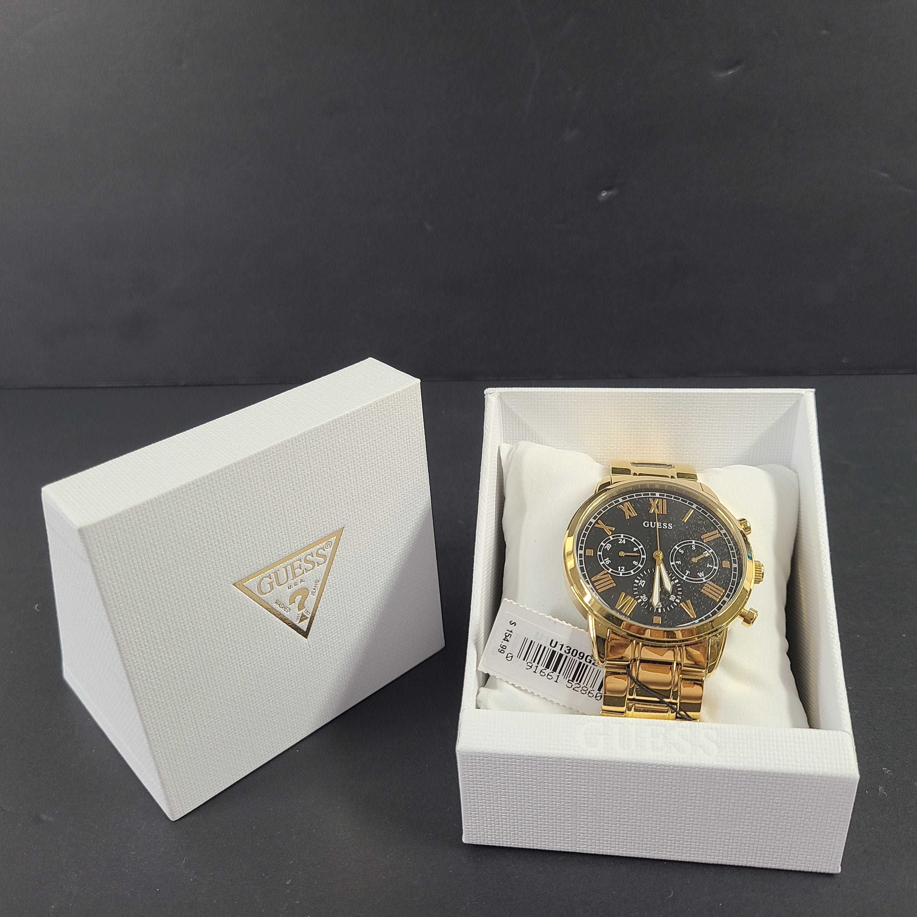 A stylish men's gold-tone stainless steel chronograph watch by GUESS.