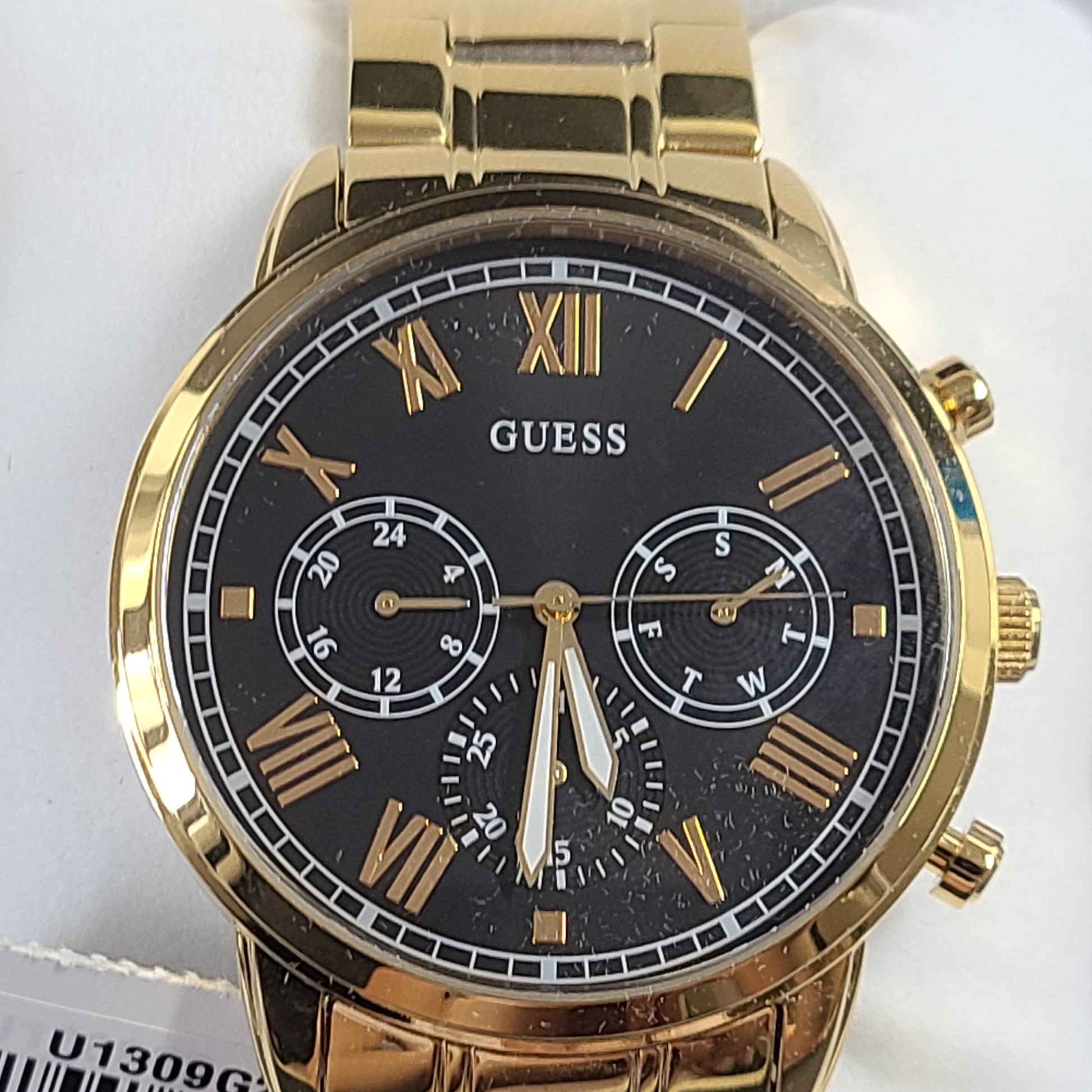 A stylish men's gold-tone stainless steel chronograph watch by GUESS.