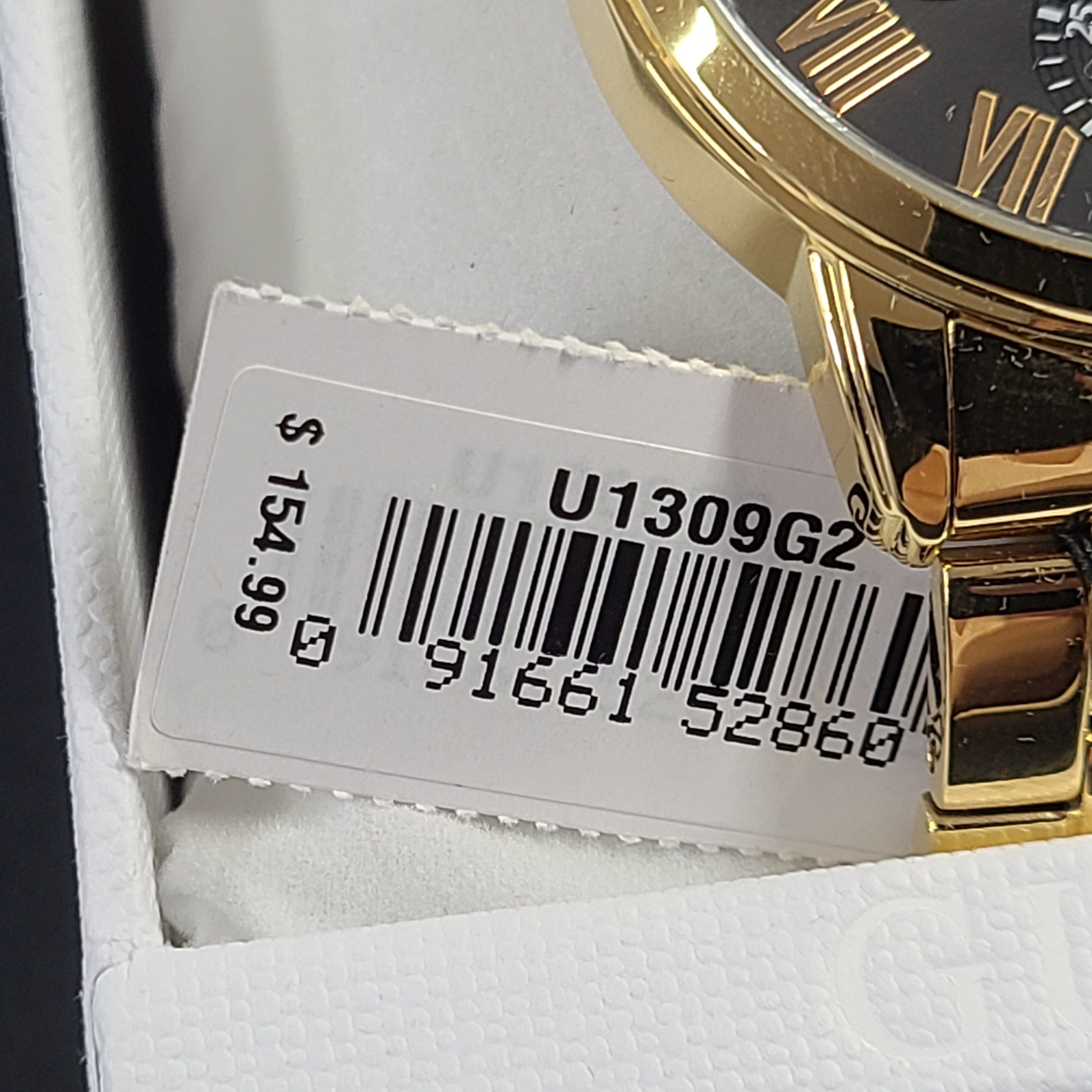A stylish men's gold-tone stainless steel chronograph watch by GUESS.