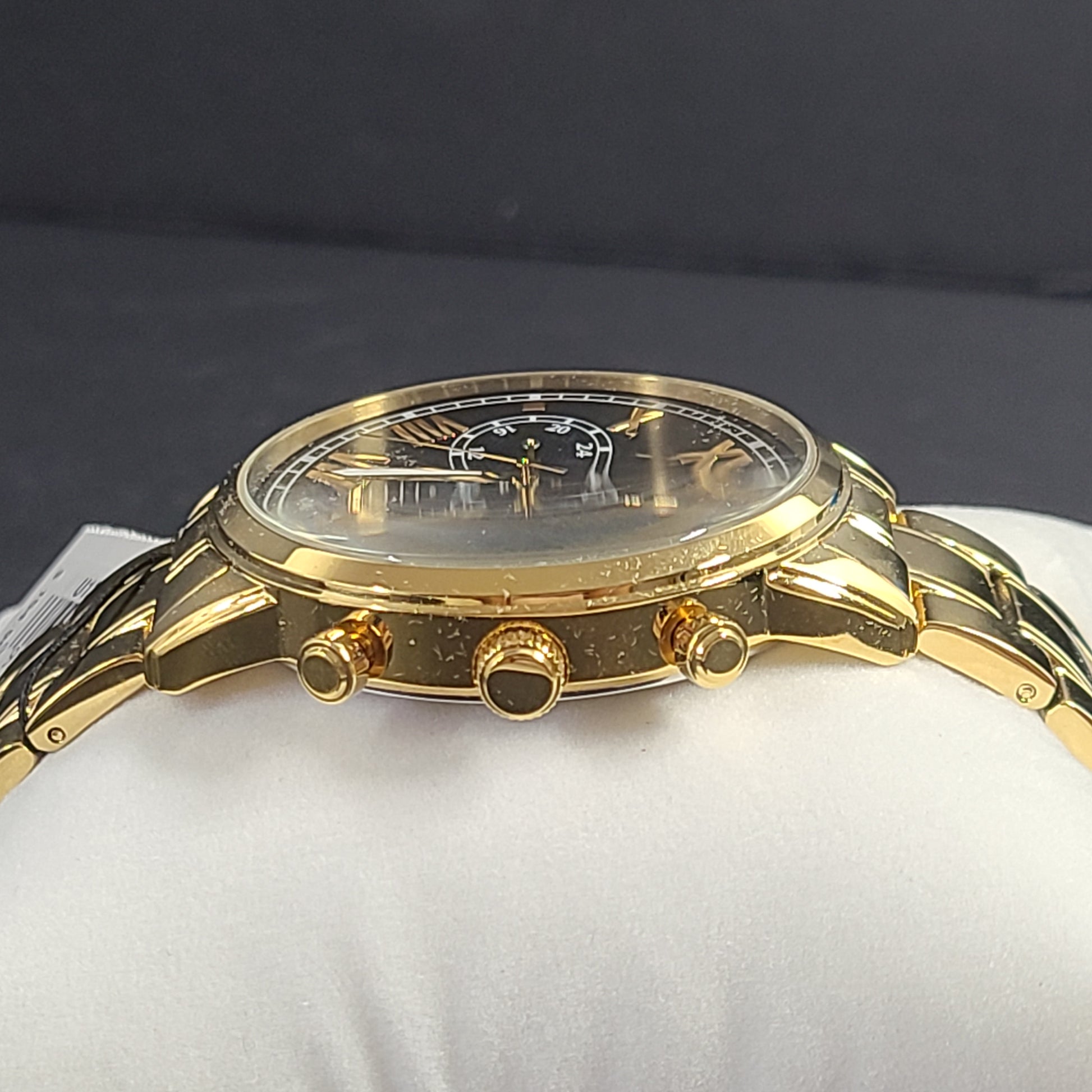 A stylish men's gold-tone stainless steel chronograph watch by GUESS.
