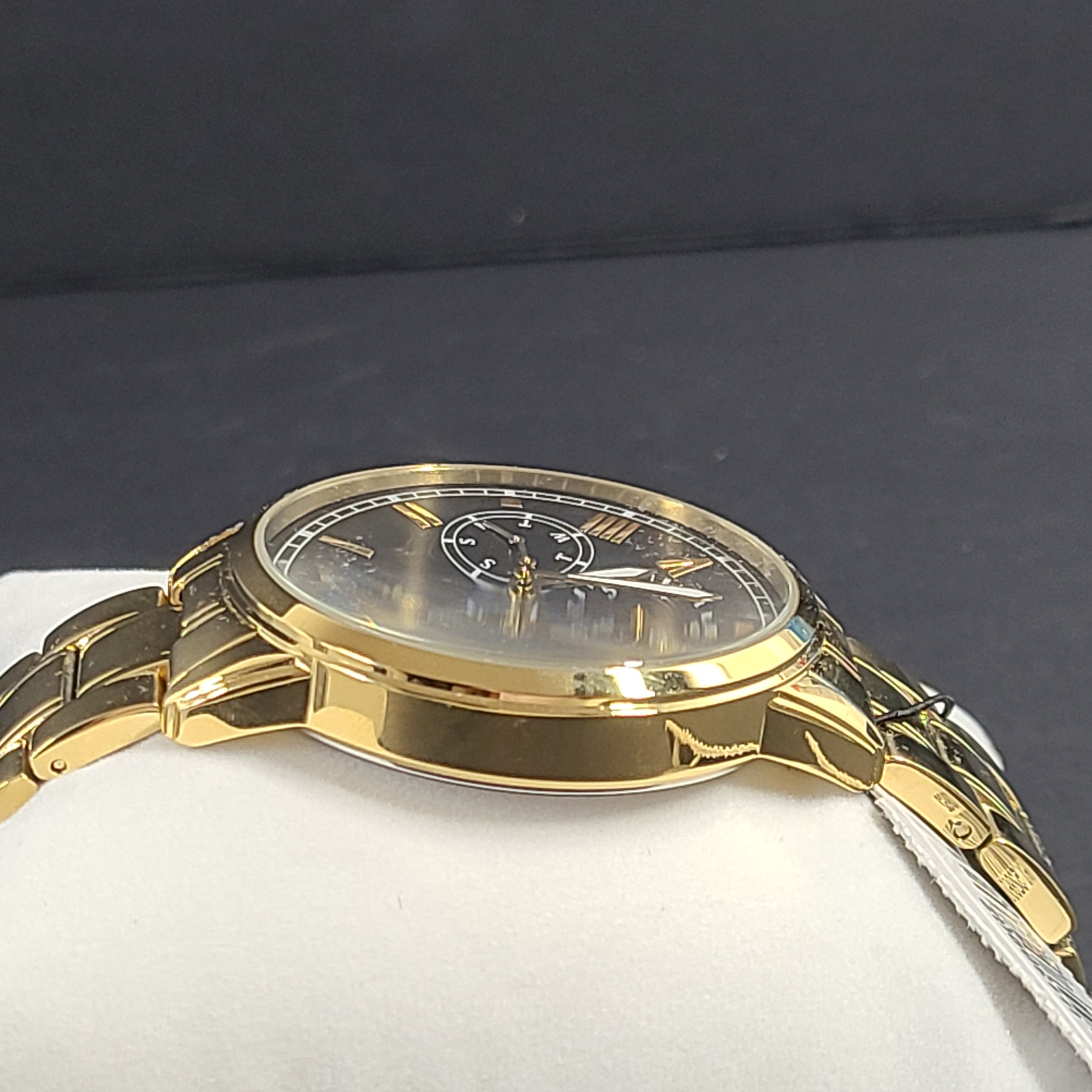 A stylish men's gold-tone stainless steel chronograph watch by GUESS.