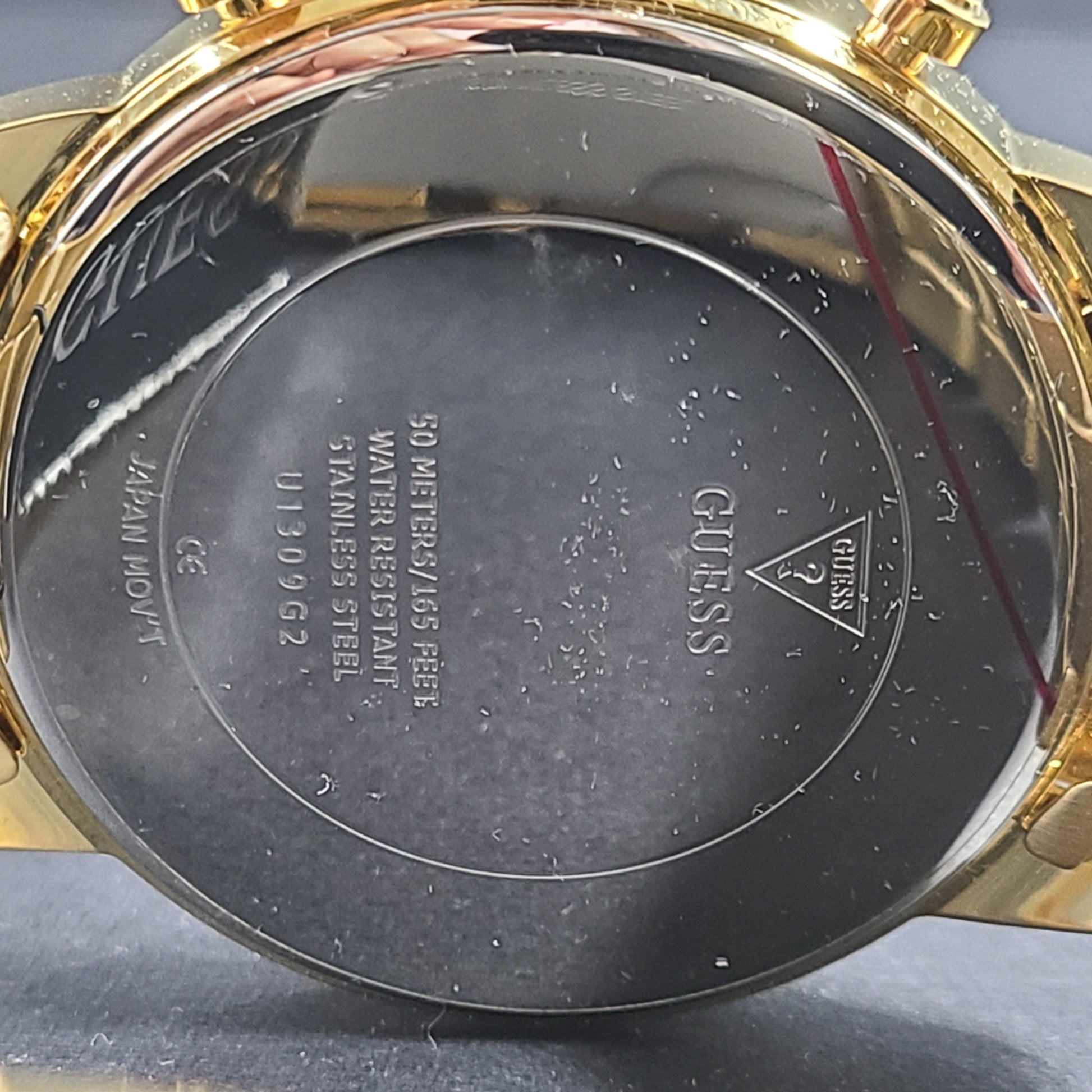 A stylish men's gold-tone stainless steel chronograph watch by GUESS.