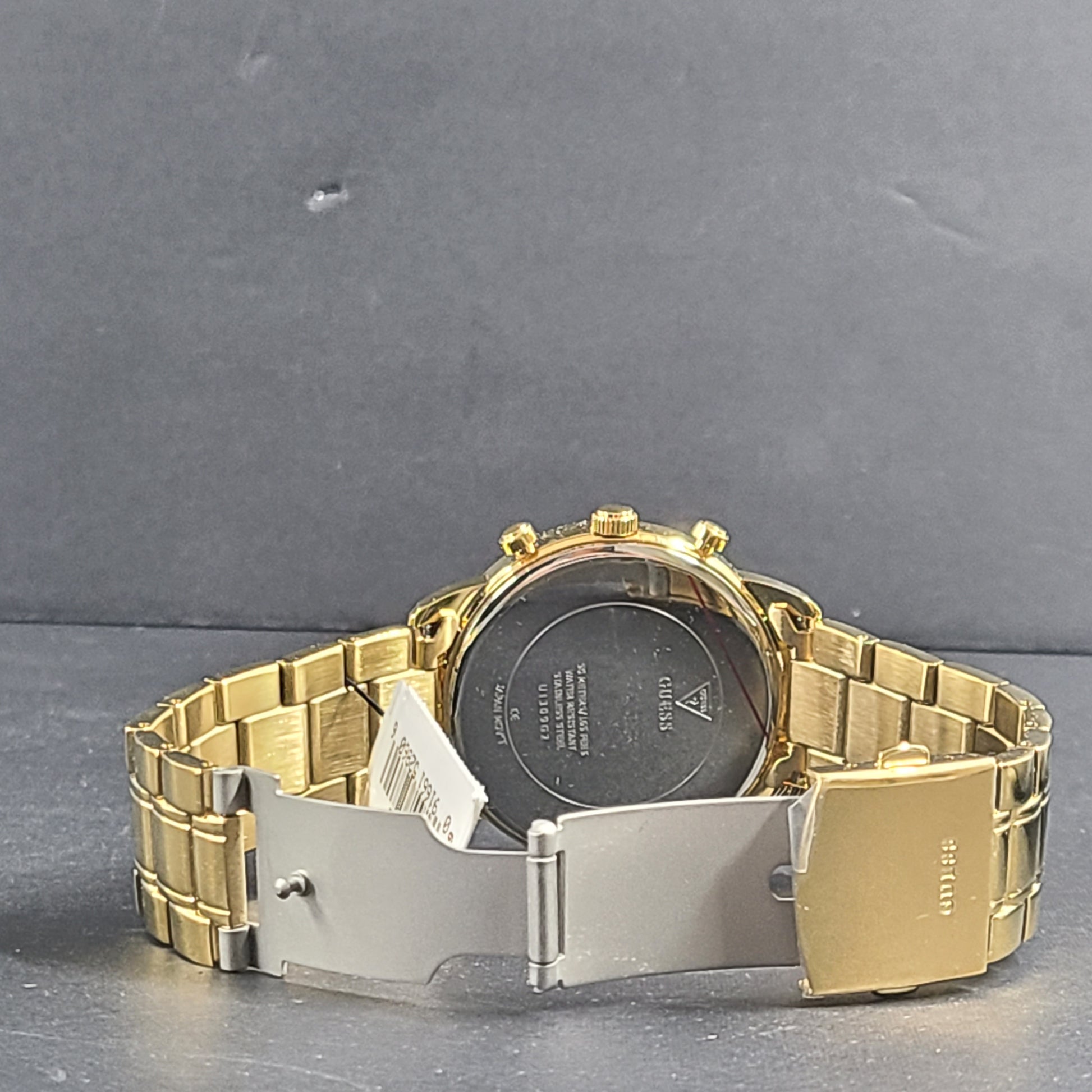 A stylish men's gold-tone stainless steel chronograph watch by GUESS.