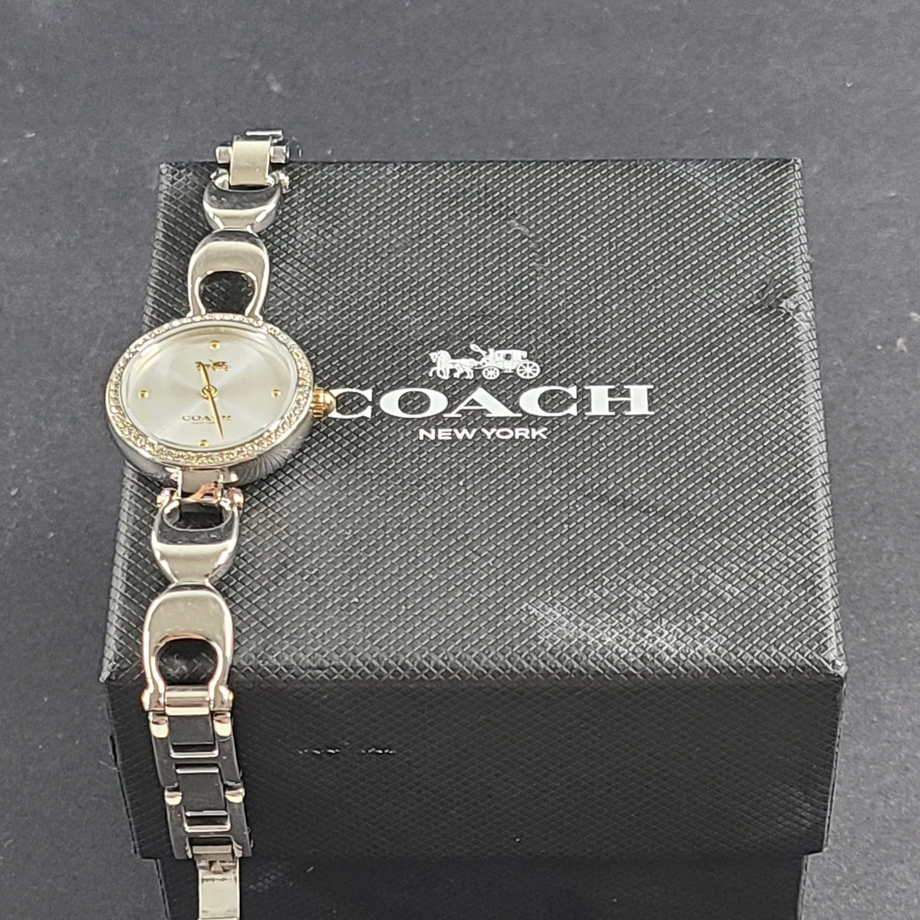 A stylish Coach women's stainless steel watch with model number 1633S.