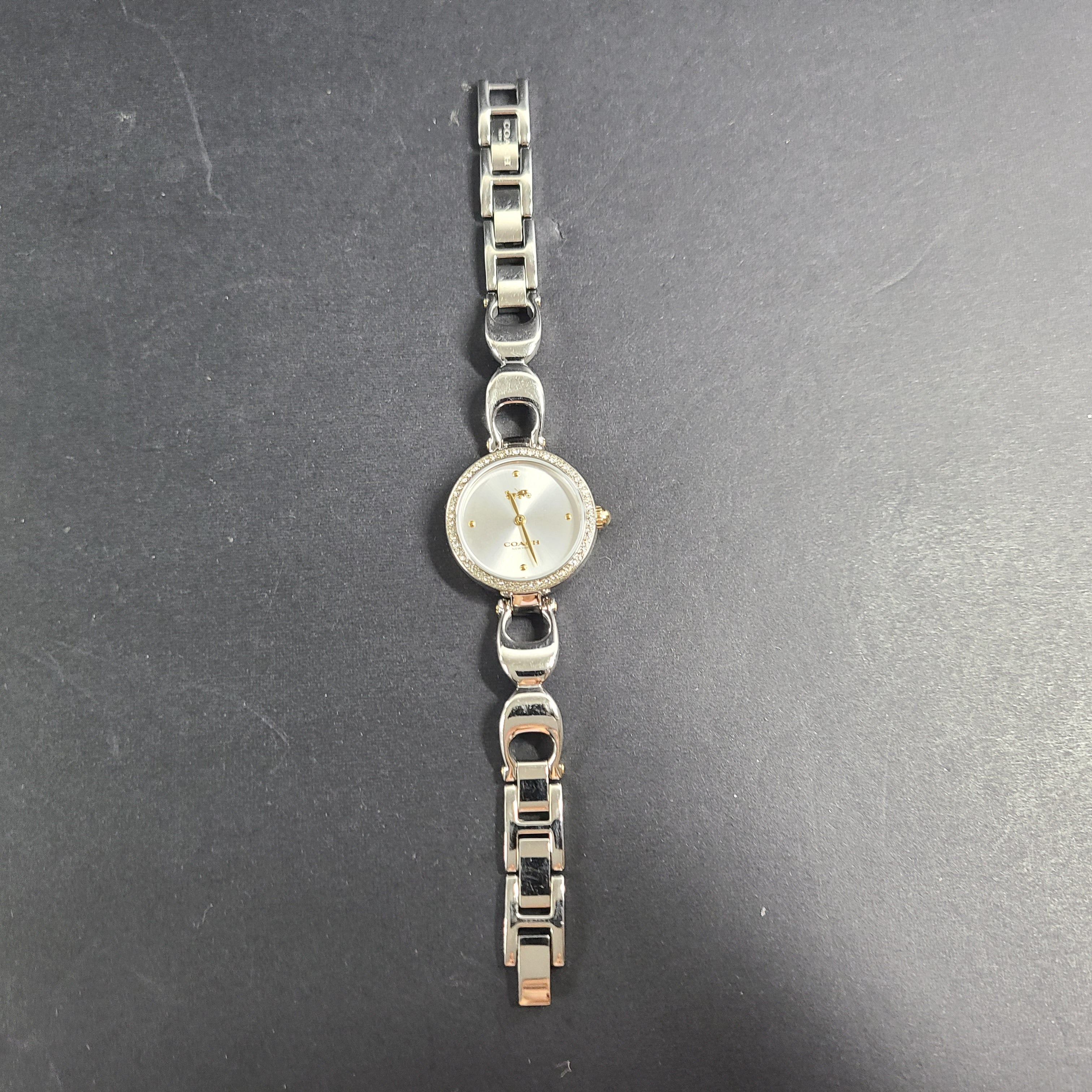 A stylish Coach women's stainless steel watch with model number 1633S.