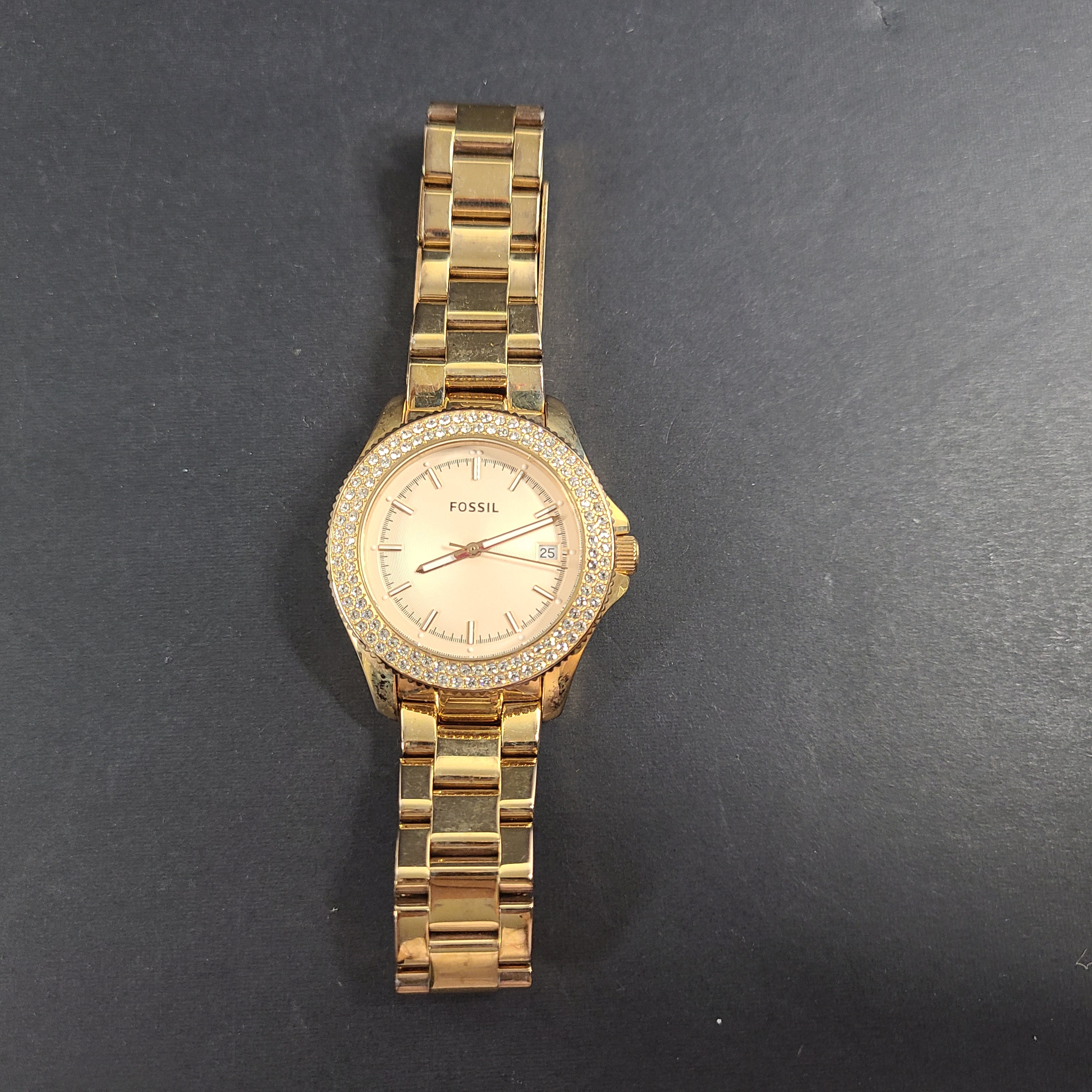 A stylish Fossil Analog Women's Watch with gold tones and crystal accents