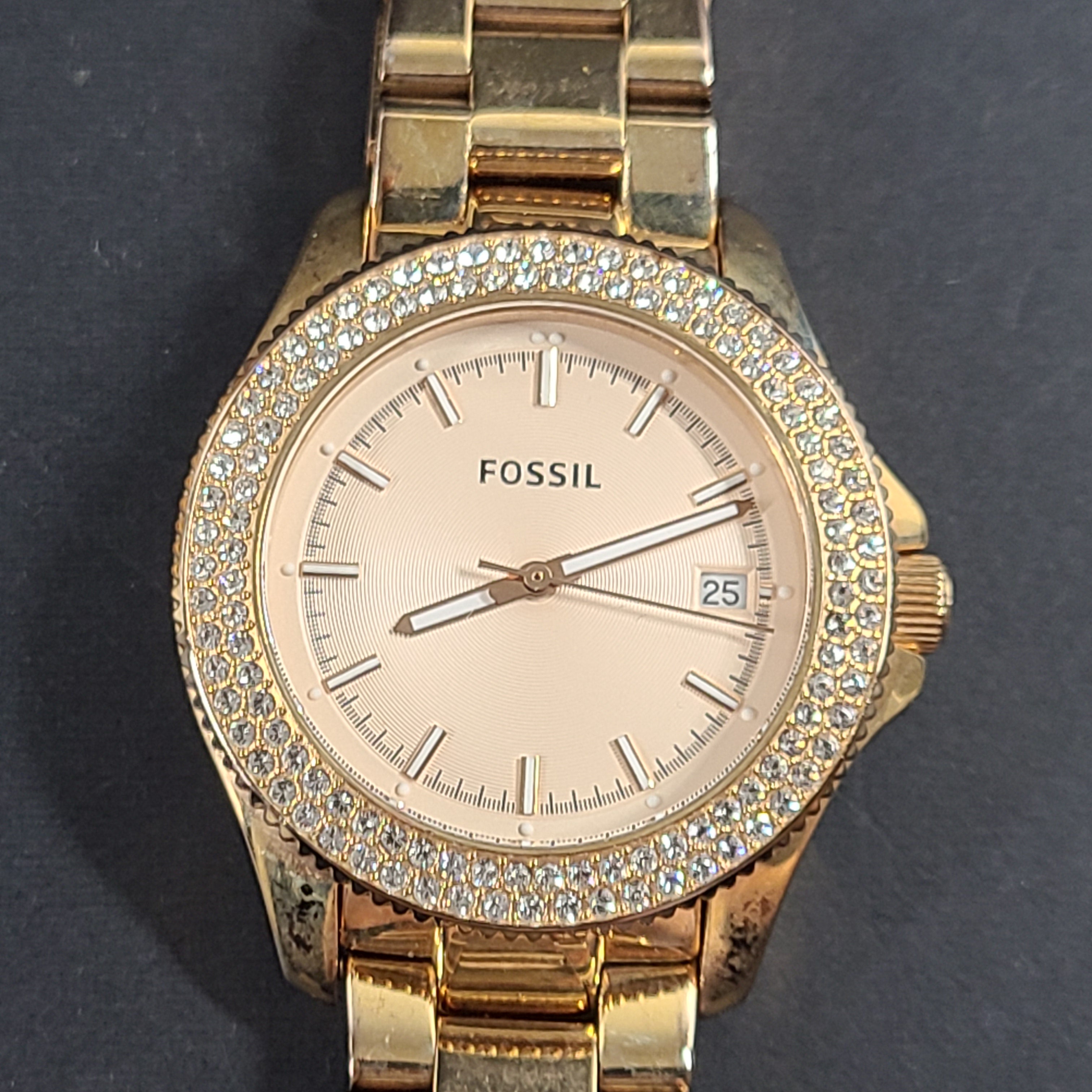 A stylish Fossil Analog Women's Watch with gold tones and crystal accents