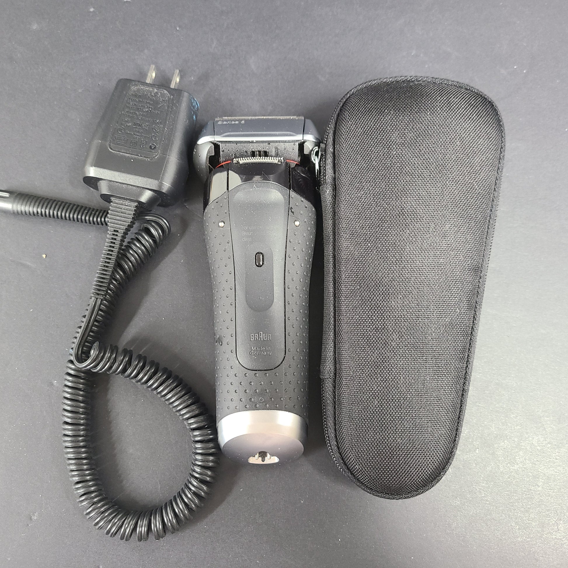 A Braun Series 5 Electric Shaver in pre-owned condition with charging cord.