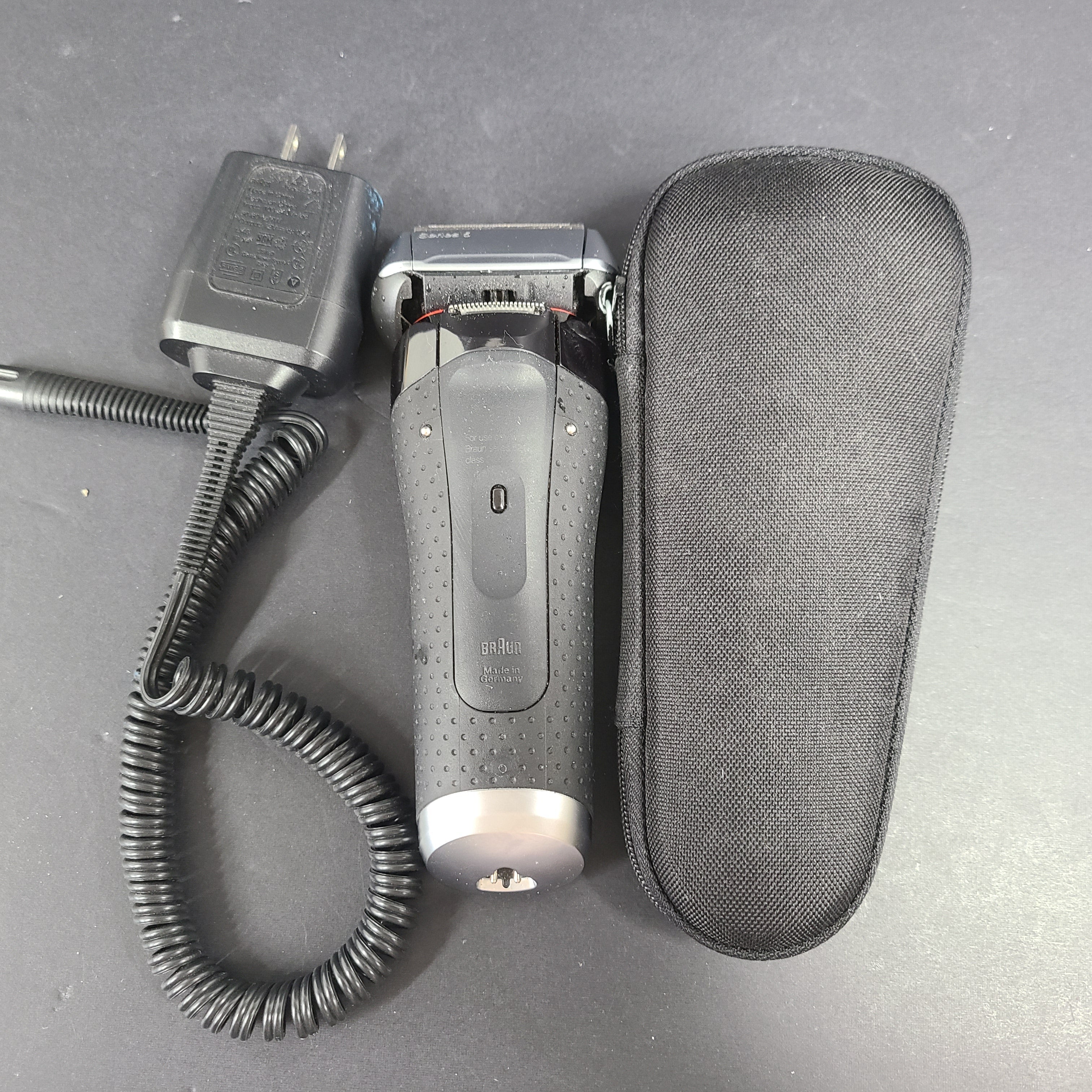 A Braun Series 5 Electric Shaver in pre-owned condition with charging cord.