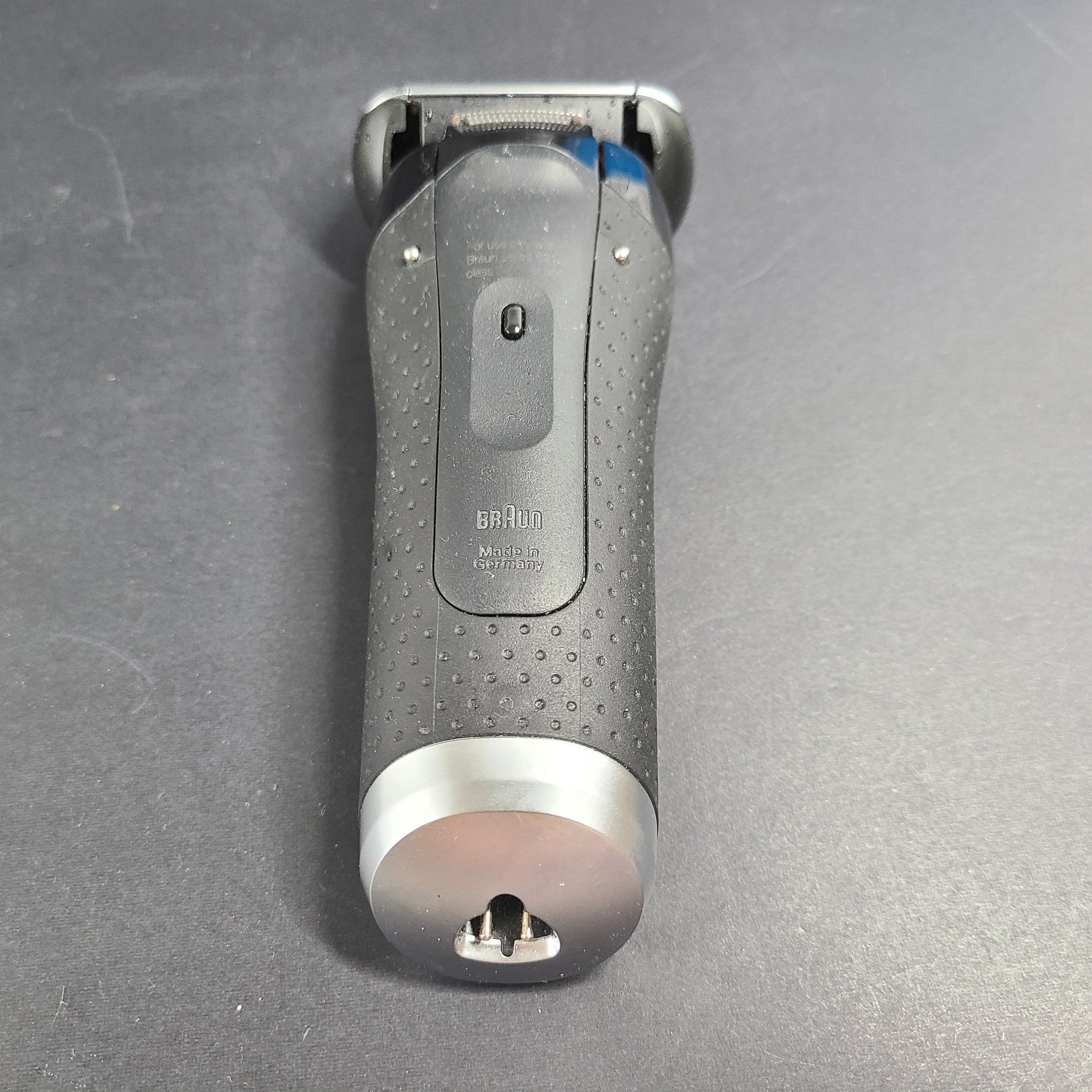 A Braun Series 5 Electric Shaver in pre-owned condition with charging cord.