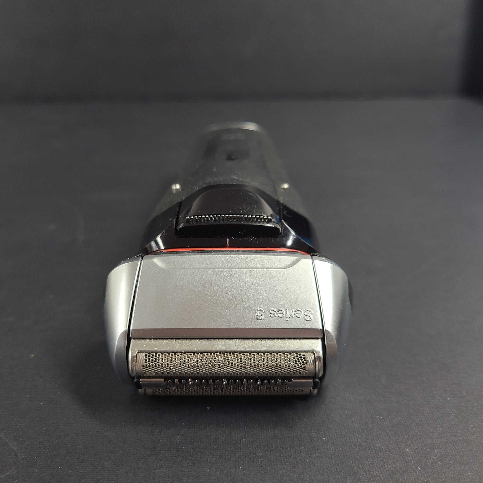 A Braun Series 5 Electric Shaver in pre-owned condition with charging cord.