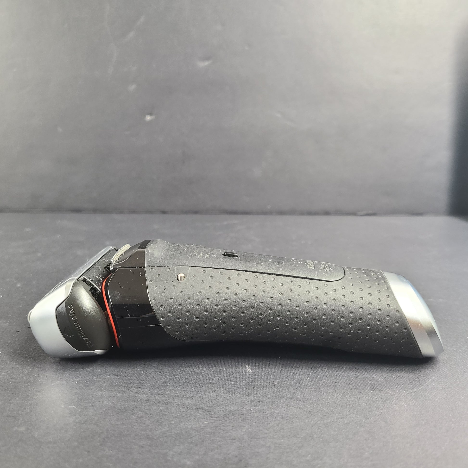 A Braun Series 5 Electric Shaver in pre-owned condition with charging cord.
