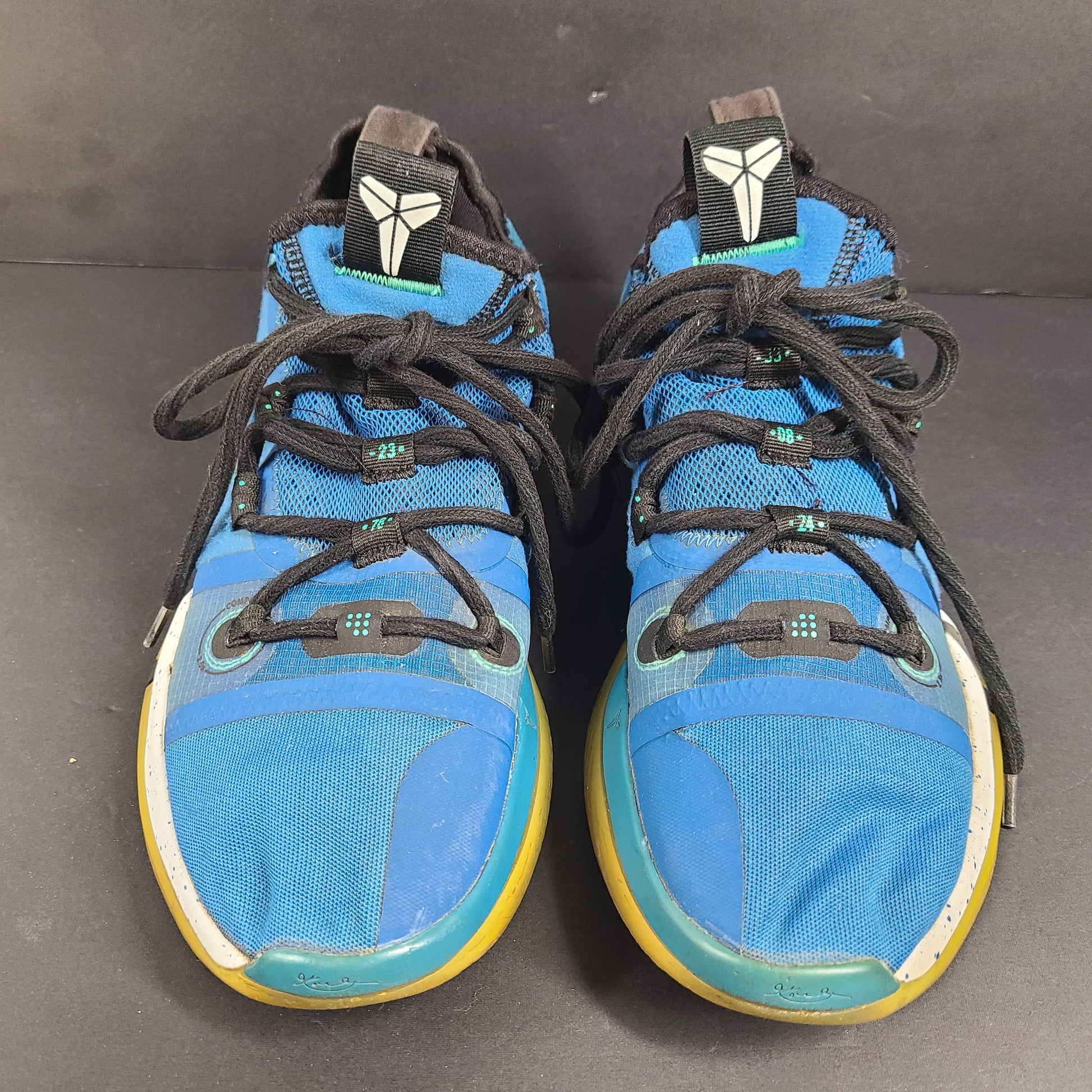 A pair of Nike Kobe AD NXT 360 Basketball Shoes in blue and yellow
