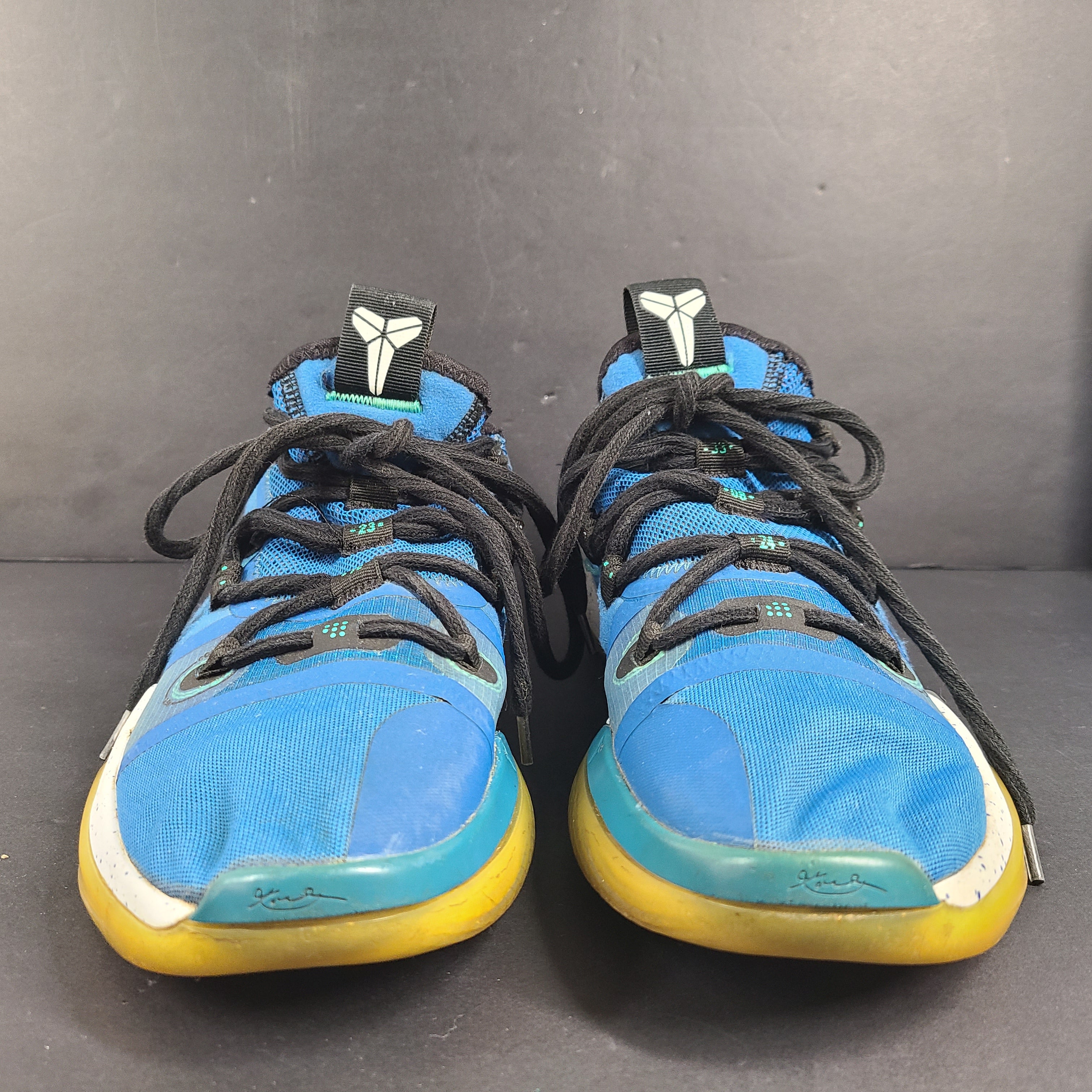 A pair of Nike Kobe AD NXT 360 Basketball Shoes in blue and yellow
