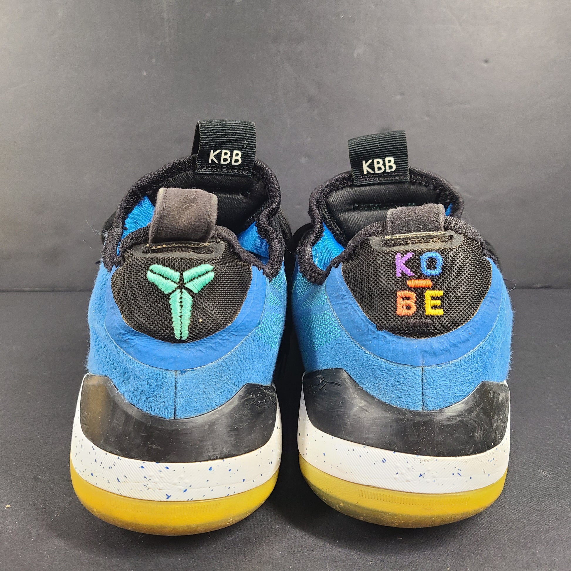 A pair of Nike Kobe AD NXT 360 Basketball Shoes in blue and yellow