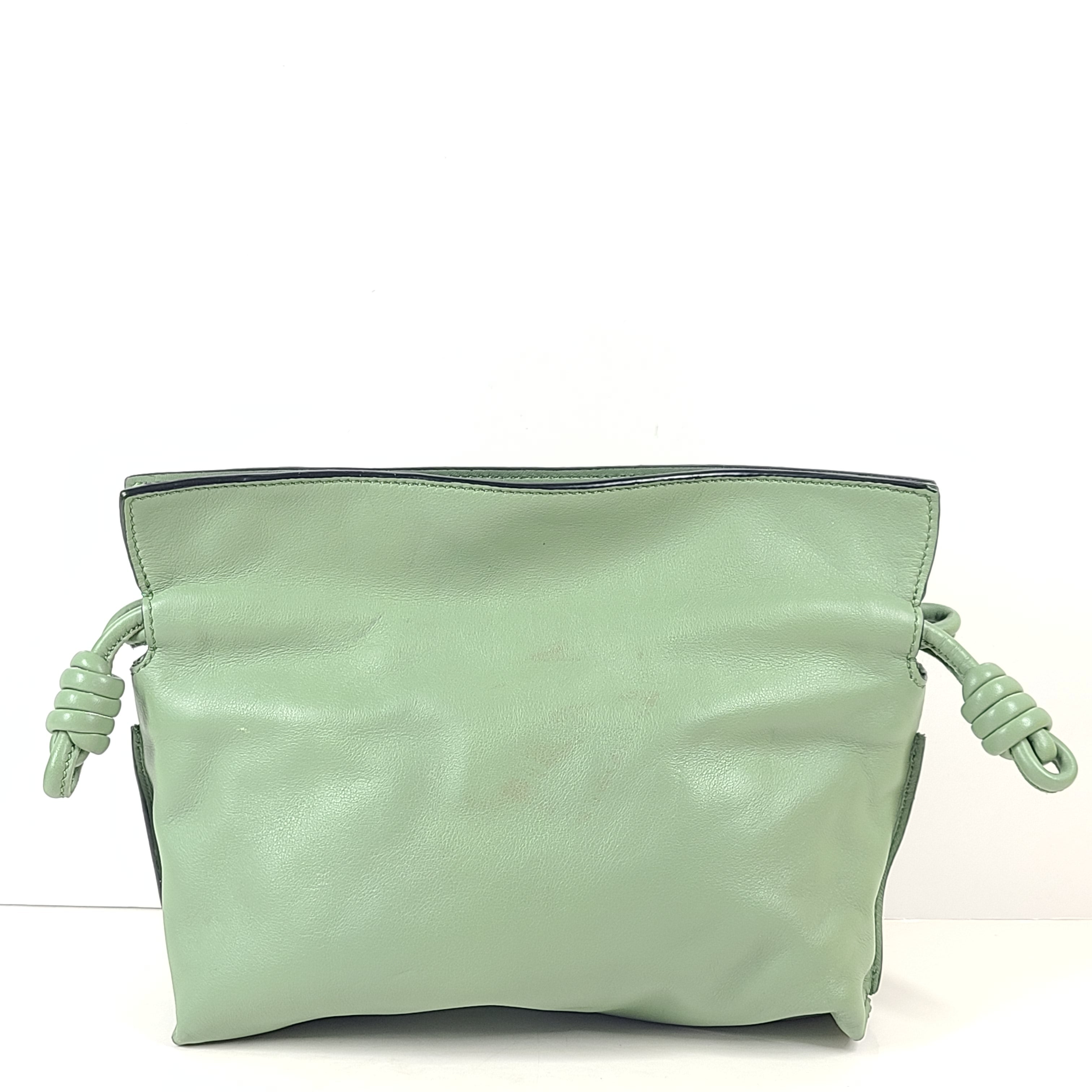 A stylish green leather Loewe shoulder bag.