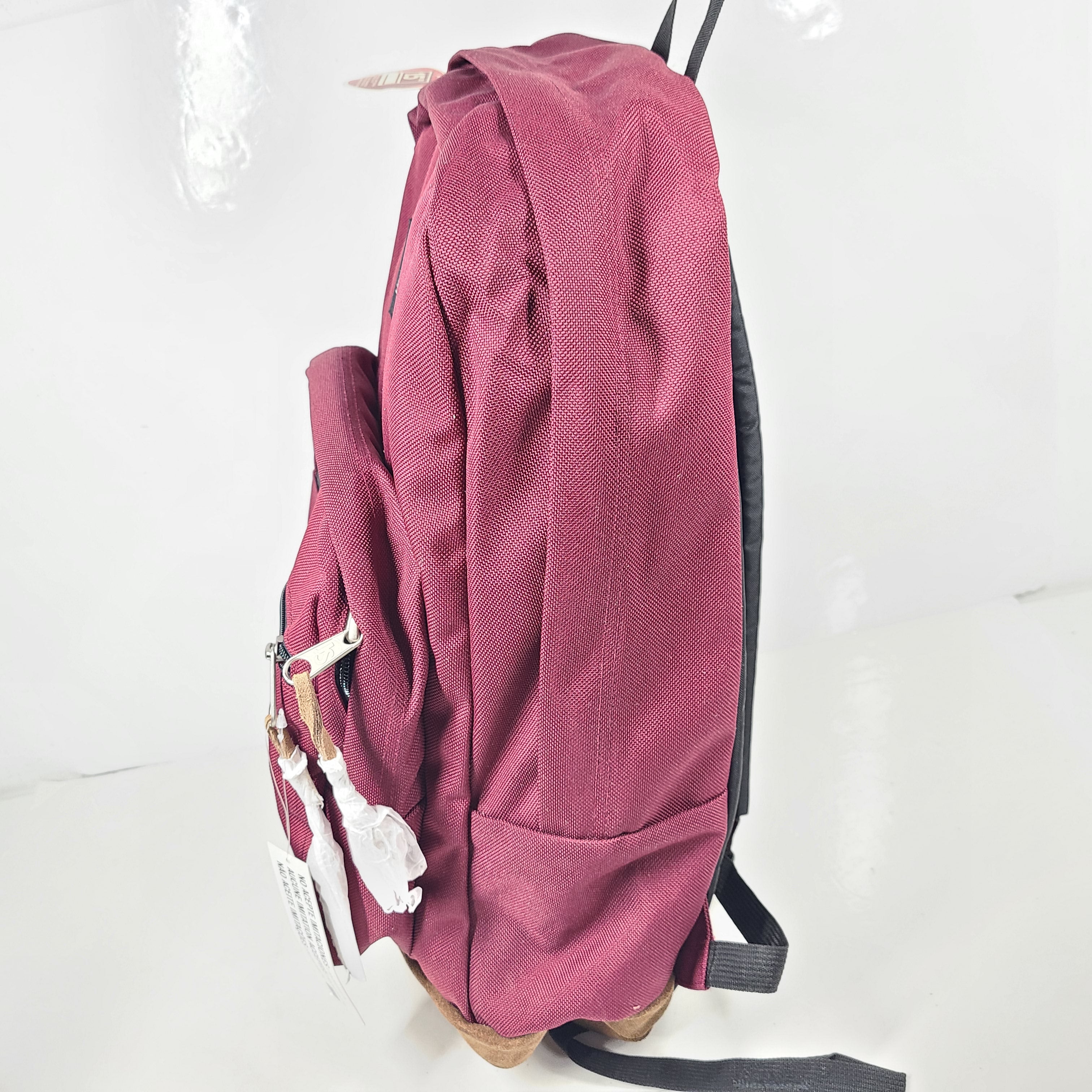 A maroon JanSport backpack with a 15" laptop sleeve.