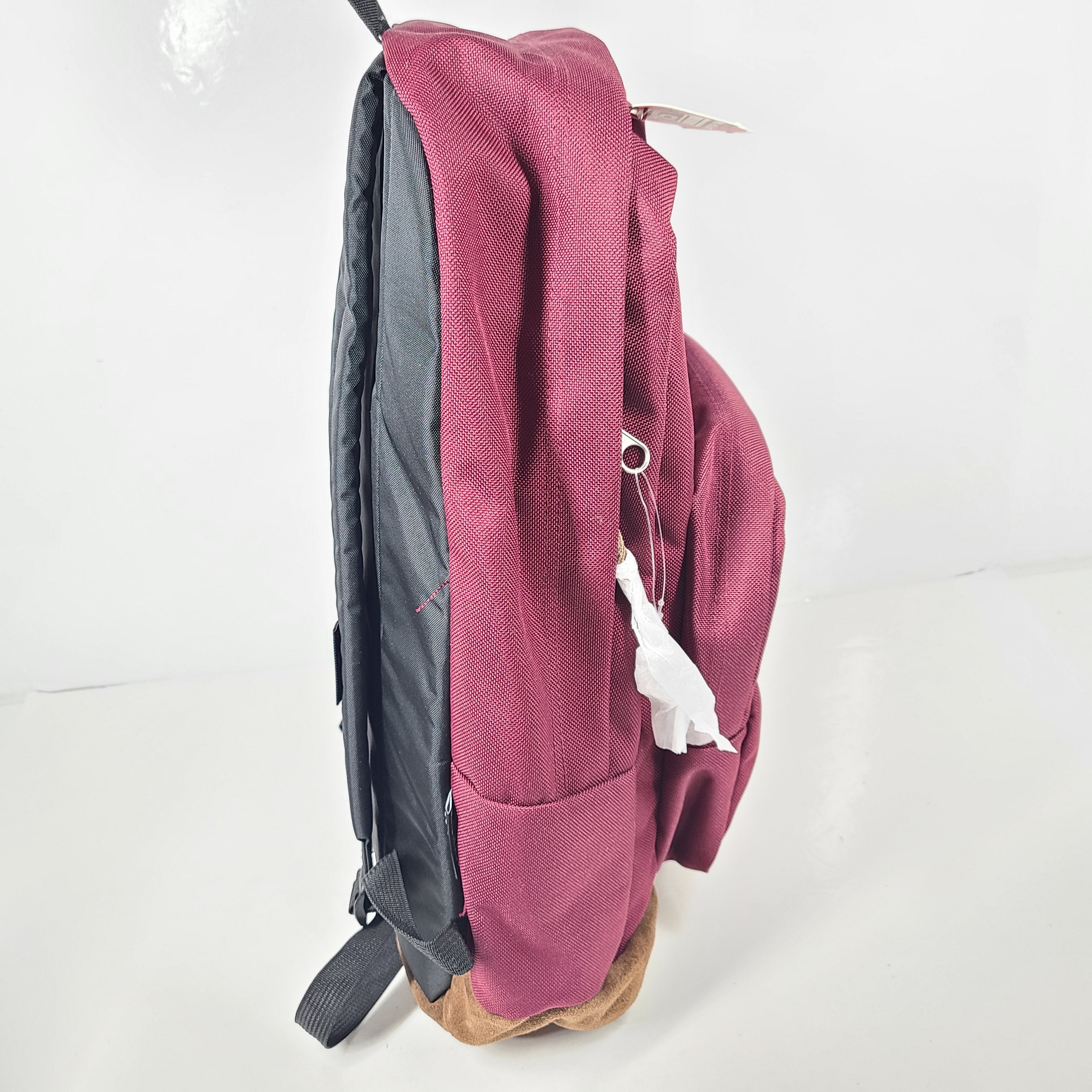 A maroon JanSport backpack with a 15" laptop sleeve.