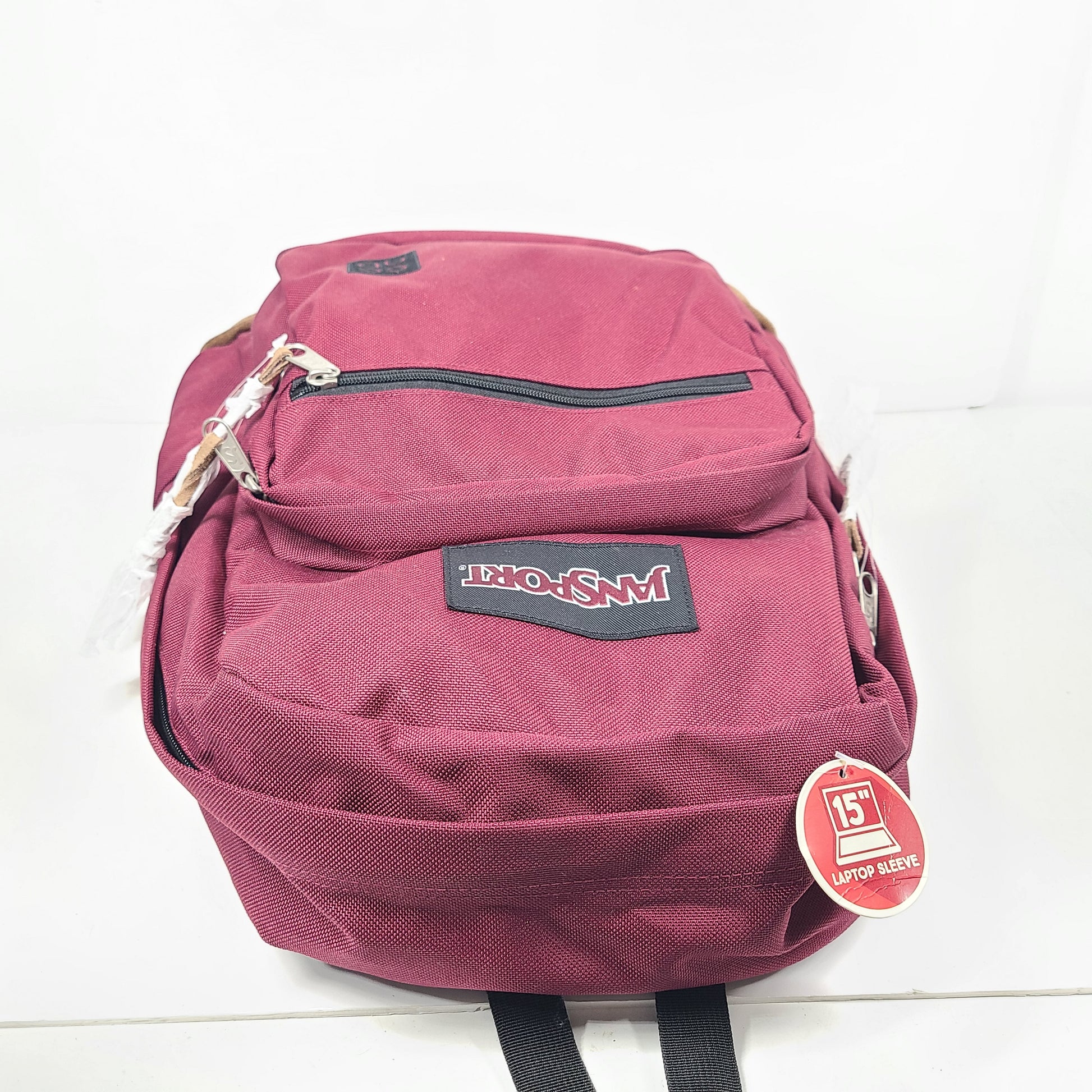 A maroon JanSport backpack with a 15" laptop sleeve.