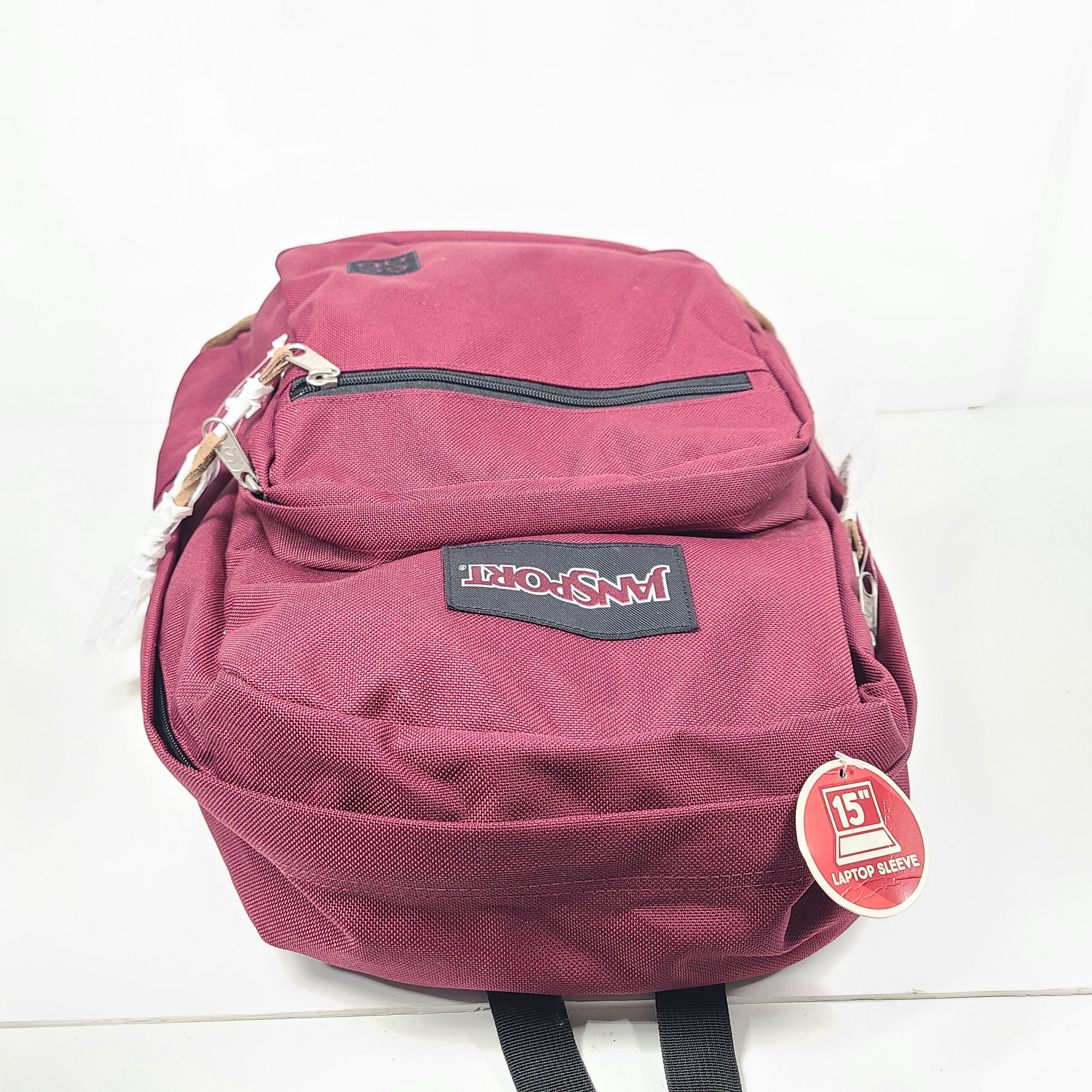 A maroon JanSport backpack with a 15" laptop sleeve.