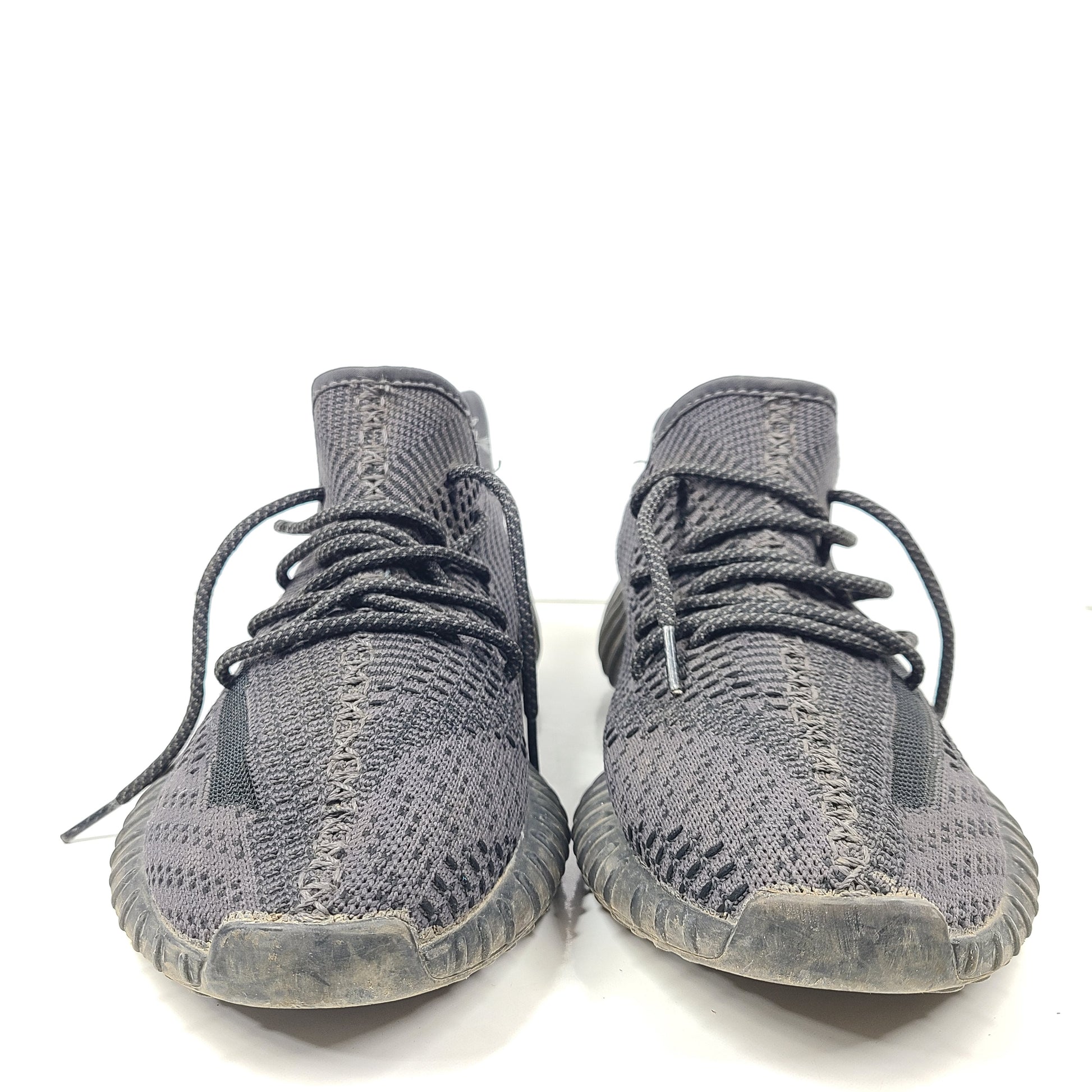 A pair of black and gray Adidas Yeezy Boost 350 V2 sneakers in size 10.5
