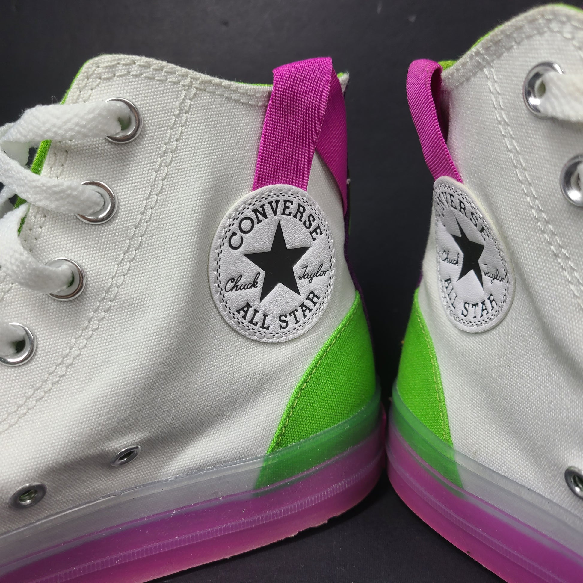 Classic Converse Chuck Taylor All Star high top sneakers in vibrant multicolor design.