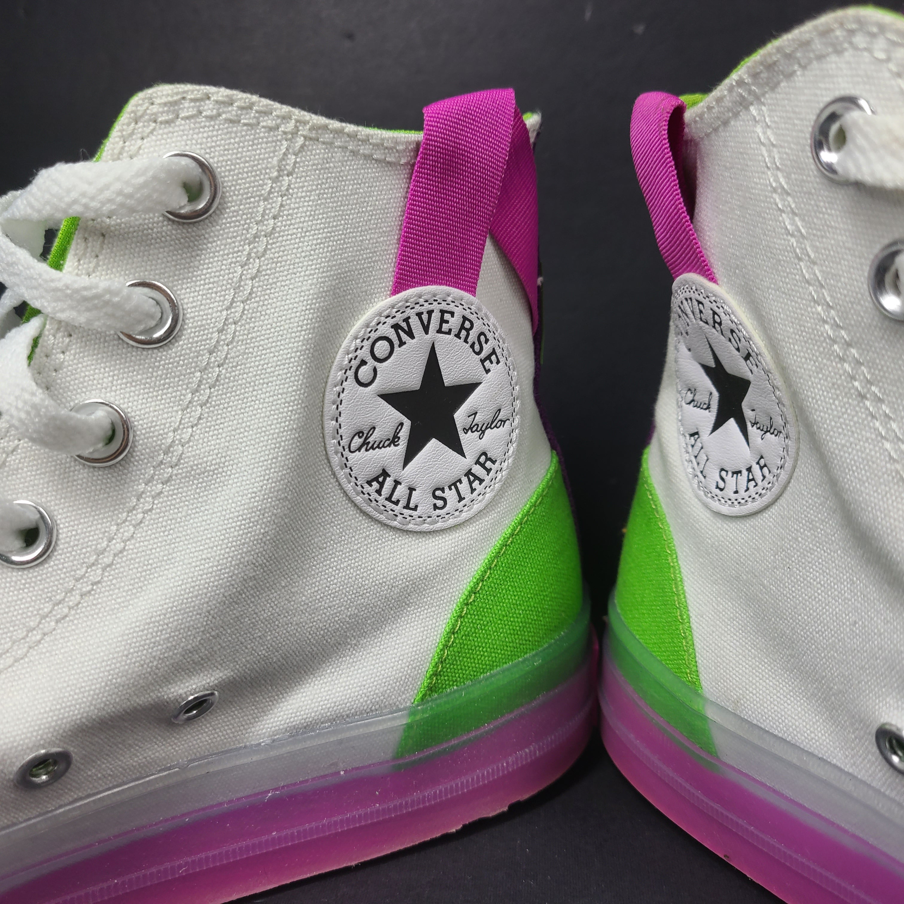 Classic Converse Chuck Taylor All Star high top sneakers in vibrant multicolor design.