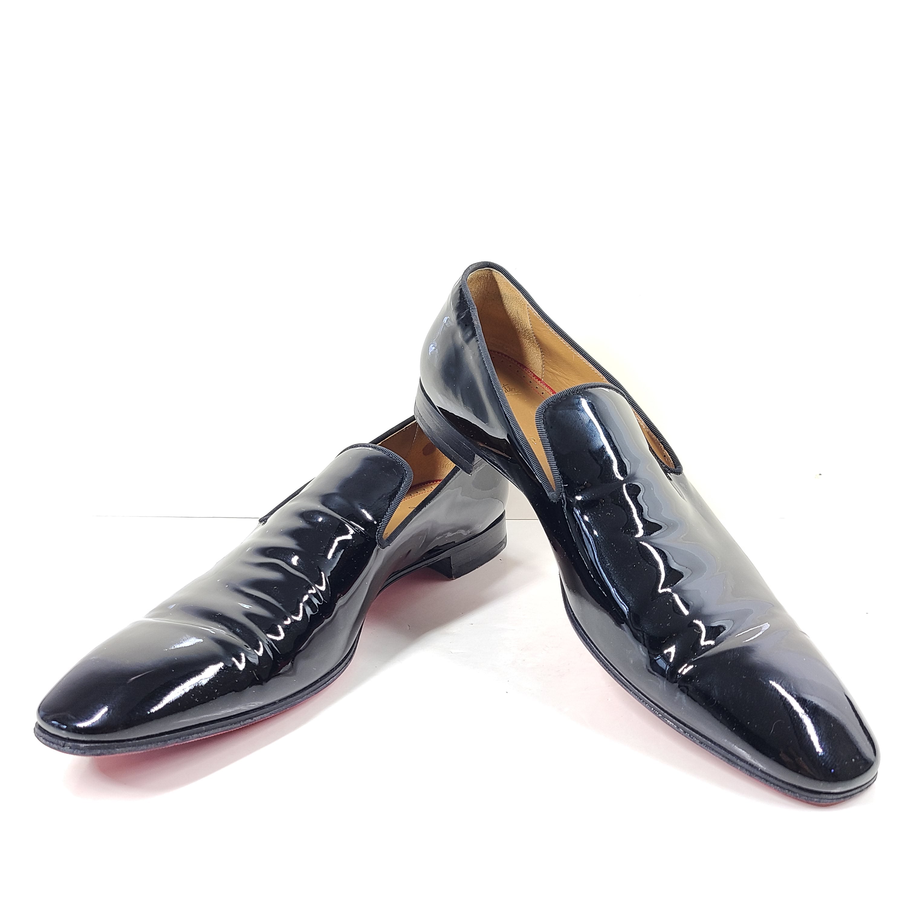 A pair of black patent leather loafers by Christian Louboutin