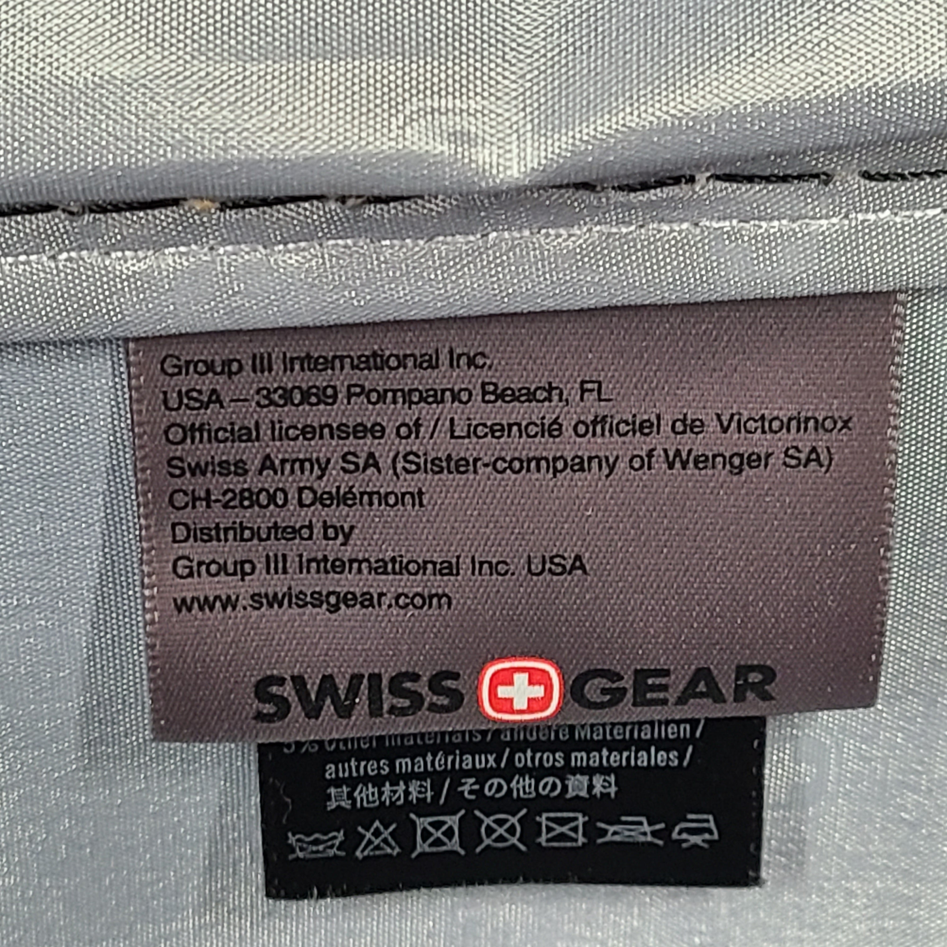 A sleek black SwissGear hardside spinner luggage SA8018.